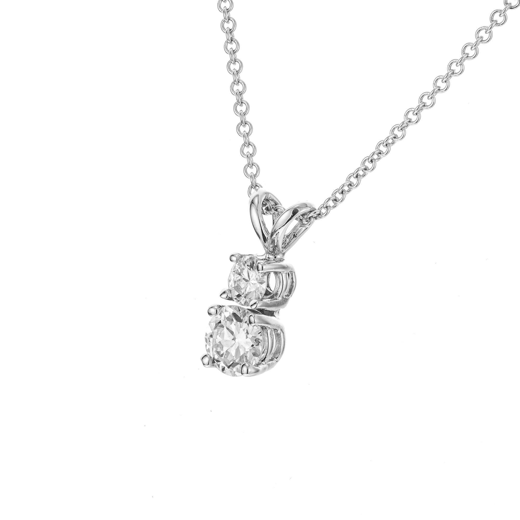 Classic two diamond pendant necklace. 1 round brilliant cut .18ct diamond with a second round brilliant cut .49ct diamonds below set in 14k white gold. 16 inch 14k white gold chain. 

1 round brilliant cut diamond, I-J VS2 approx. .49cts
1 round