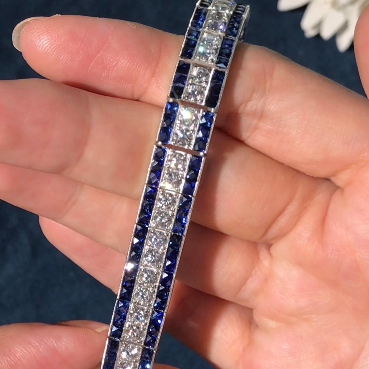 This stunning, fine and impressive antique style ruby bracelet with diamonds is crafted in platinum 950.  The fully articulated bracelet is composed of 15.84 carat blue sapphires and 6.7 carats round brilliant diamonds. This wonderful piece is a