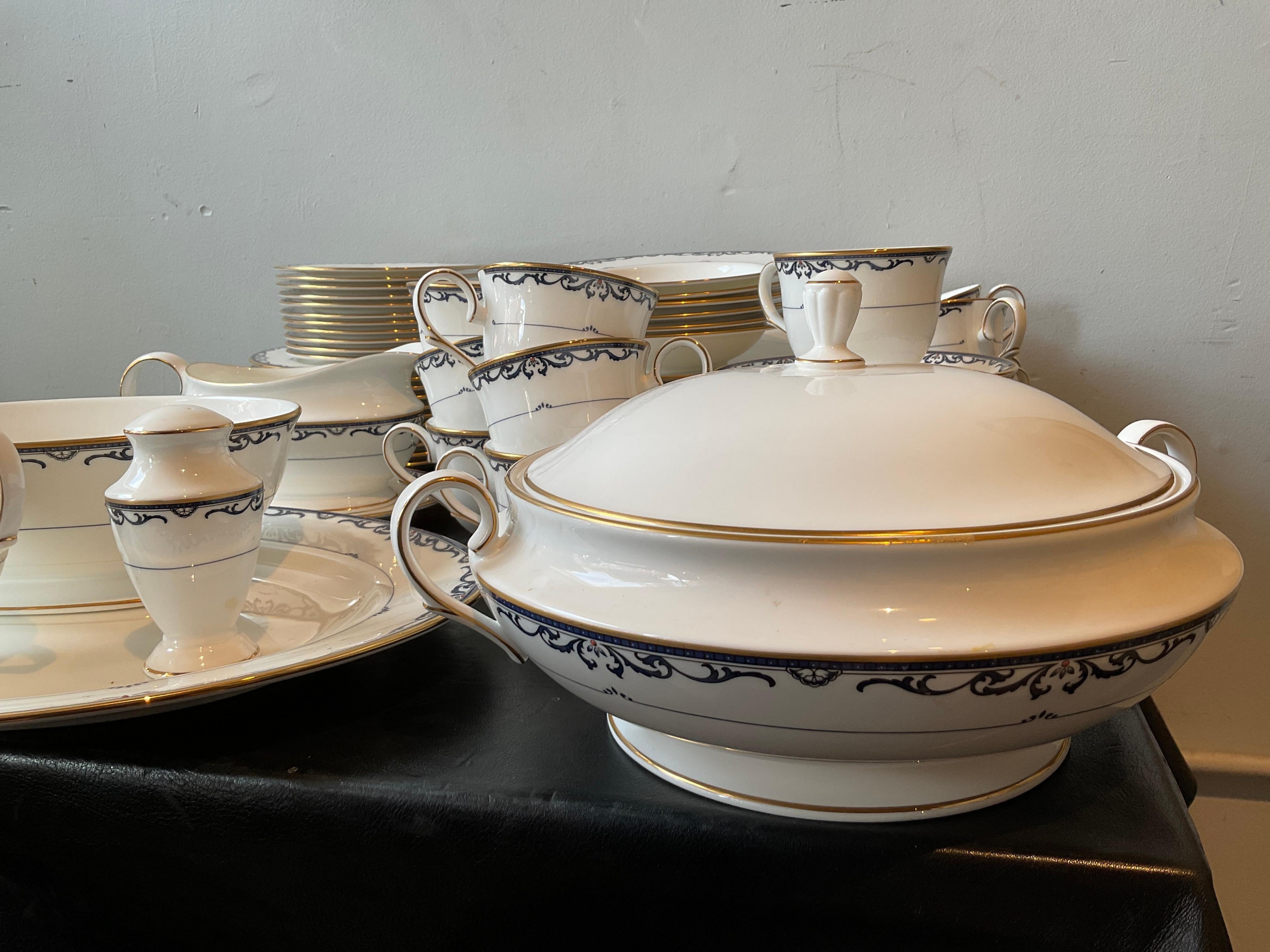 LENOX ROYAL SCROLL 
11 Dinner Plates
11 Salad plates
6 Soup bowls
11 Bread and butter plates
11 Saucers
11 Cups
1 Gravy boat and plate
1 Tureen 
1 large Platter
1 serving bowl
1 Salt shaker
1 Creamer



