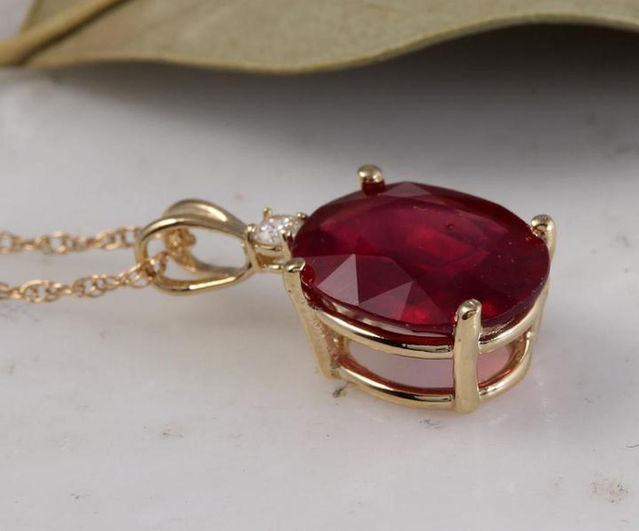 6.70Ct Natural Red Ruby and Diamond 14K Solid Yellow Gold Necklace

Amazing looking piece!

Stamped: 14K

Natural Oval Cut Ruby Weights: 6.70 Carats

Ruby Measures: 12 x 10mm

Total Natural Round Diamond weights: 0.05 Carats (H / SI2)

Total Chain