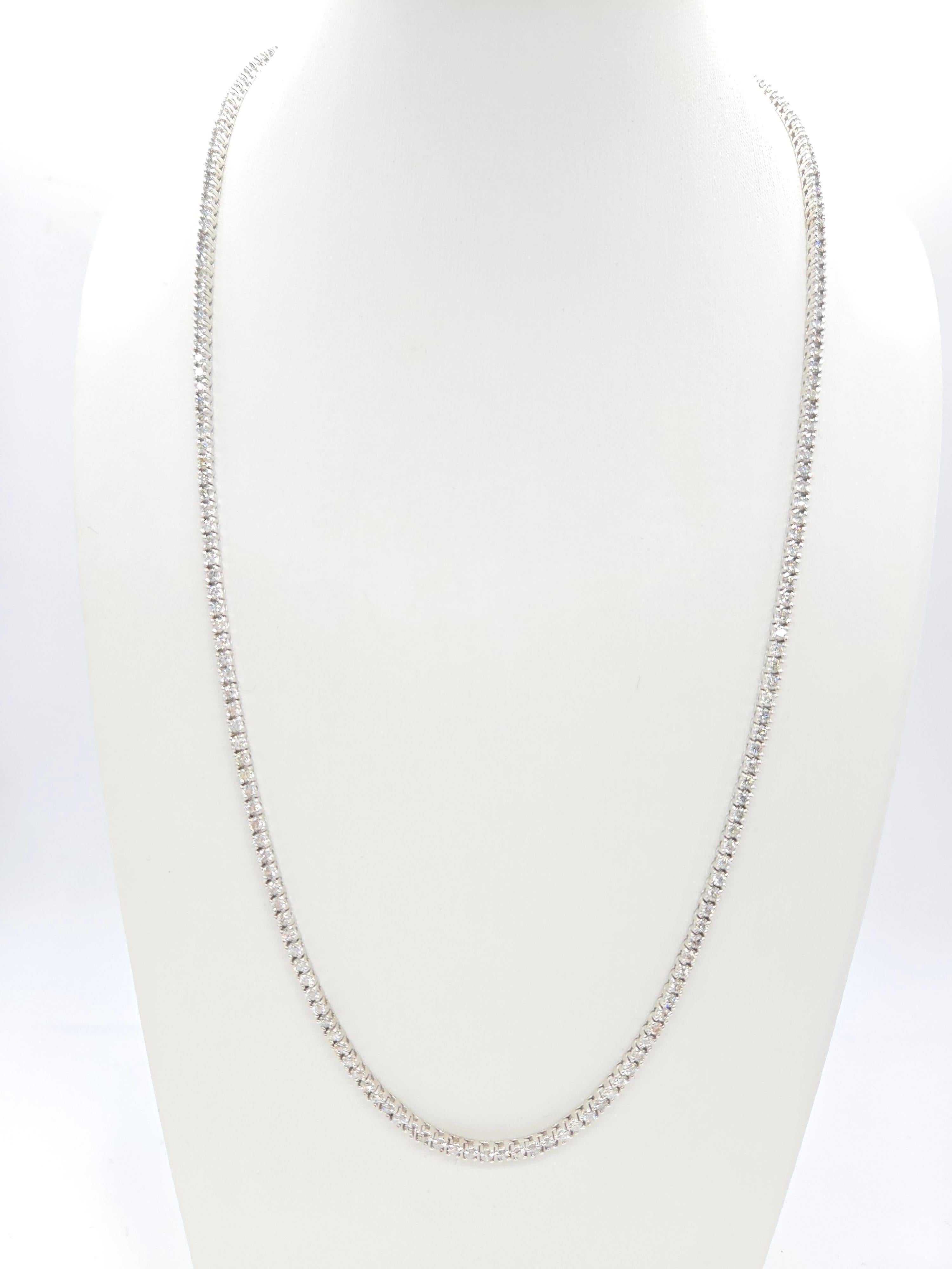 Elegant Tennis Necklace with Round-Brilliant Cut White Diamonds

This luxurious tennis necklace showcases round-brilliant cut white diamonds, renowned for their exceptional sparkle and brilliance. With a classic four-prong setting, the necklace