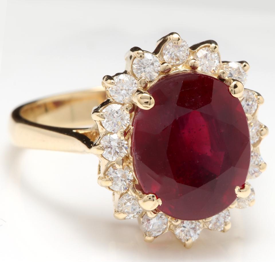 6.70 Carats Impressive Red Ruby and Natural Diamond 14K Yellow Gold Ring

Total Red Ruby Weight is: Approx. 6.00 Carats

Ruby Treatment: Lead Glass Filling

Ruby Measures: Approx. 11.00 x 9.00mm

Natural Round Diamonds Weight: Approx. 0.70 Carats