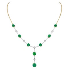 6.70ct round Emerald Necklace, featuring lily-cut diamonds in platinum.