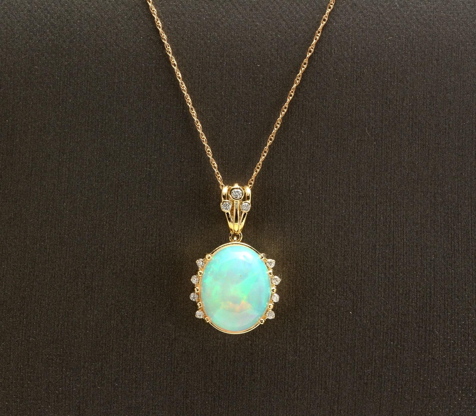 6.70Ct Natural Ethiopian Opal and Diamond 14K Solid Yellow Gold Necklace

Amazing looking piece! 

Stamped: 14K

Suggested Replacement Value: $4,500.00 

Natural Oval Cut Opal Weights: Approx. 6.50 Carats 

Opal Measures: Approx. 15.00 x