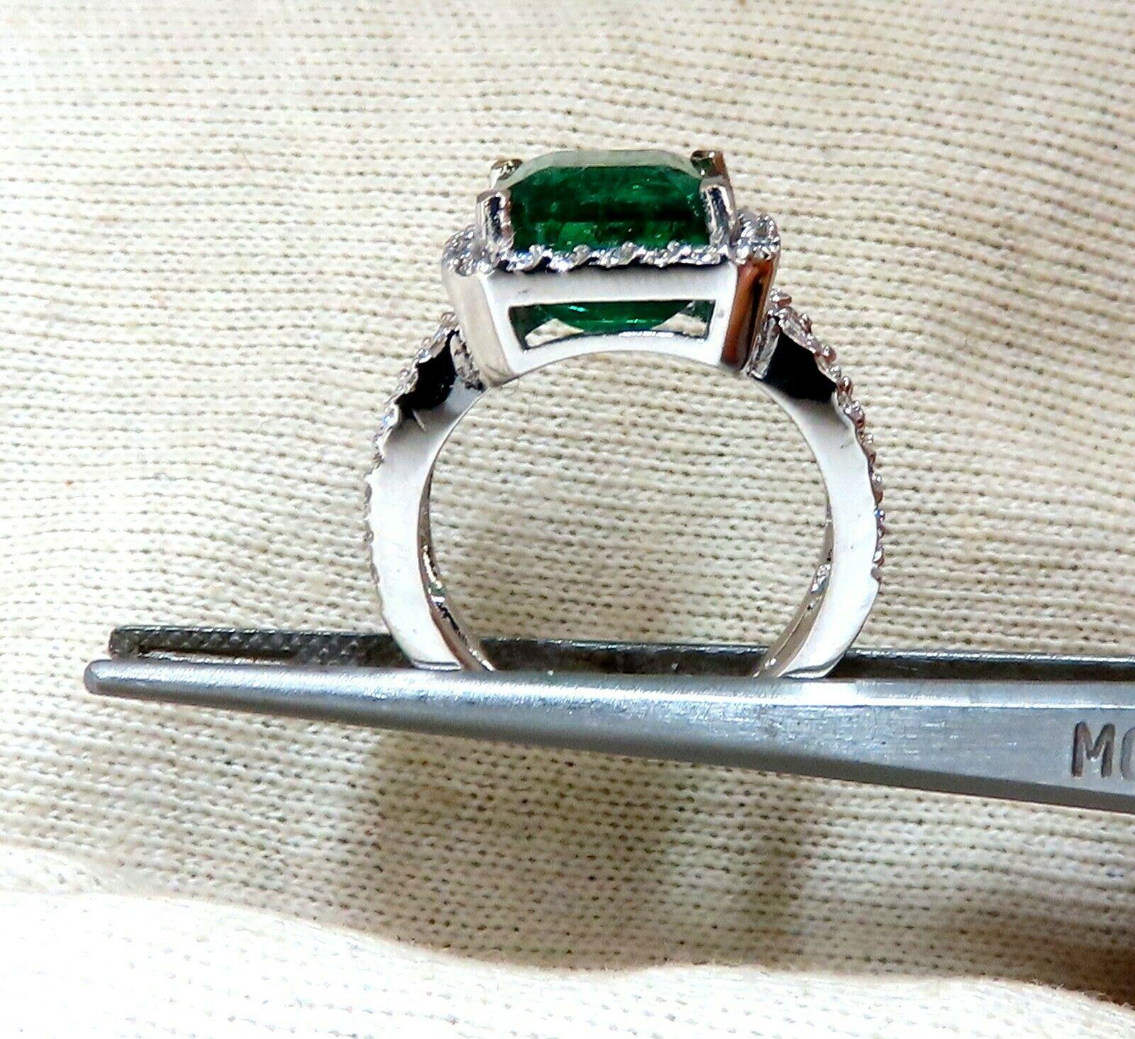 Split Shank Vivid Green.

6.70ct. Natural Emerald Ring

Emerald cut Brilliant 

11 x 9.7mm 

Transparent & Vivid Green 

.66ct. Diamonds.

Rounds & full cuts 

G-color Vs-2 clarity.  

14kt. white gold

7.7 grams

Ring Current size: 6.5

Depth of