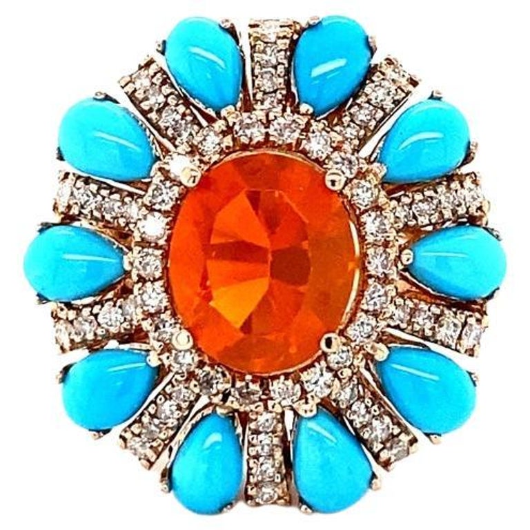 6.72 Carat Natural Fire Opal Turquoise Diamond Rose Gold Cocktail Ring

**This ring has our heart** Truly one-of-a-kind color combinations and beyond stunning in person!

Ring Specs:

Natural Mexican Fire Opal  (Oval Cut) = 2.35 carats
10 Turquoise