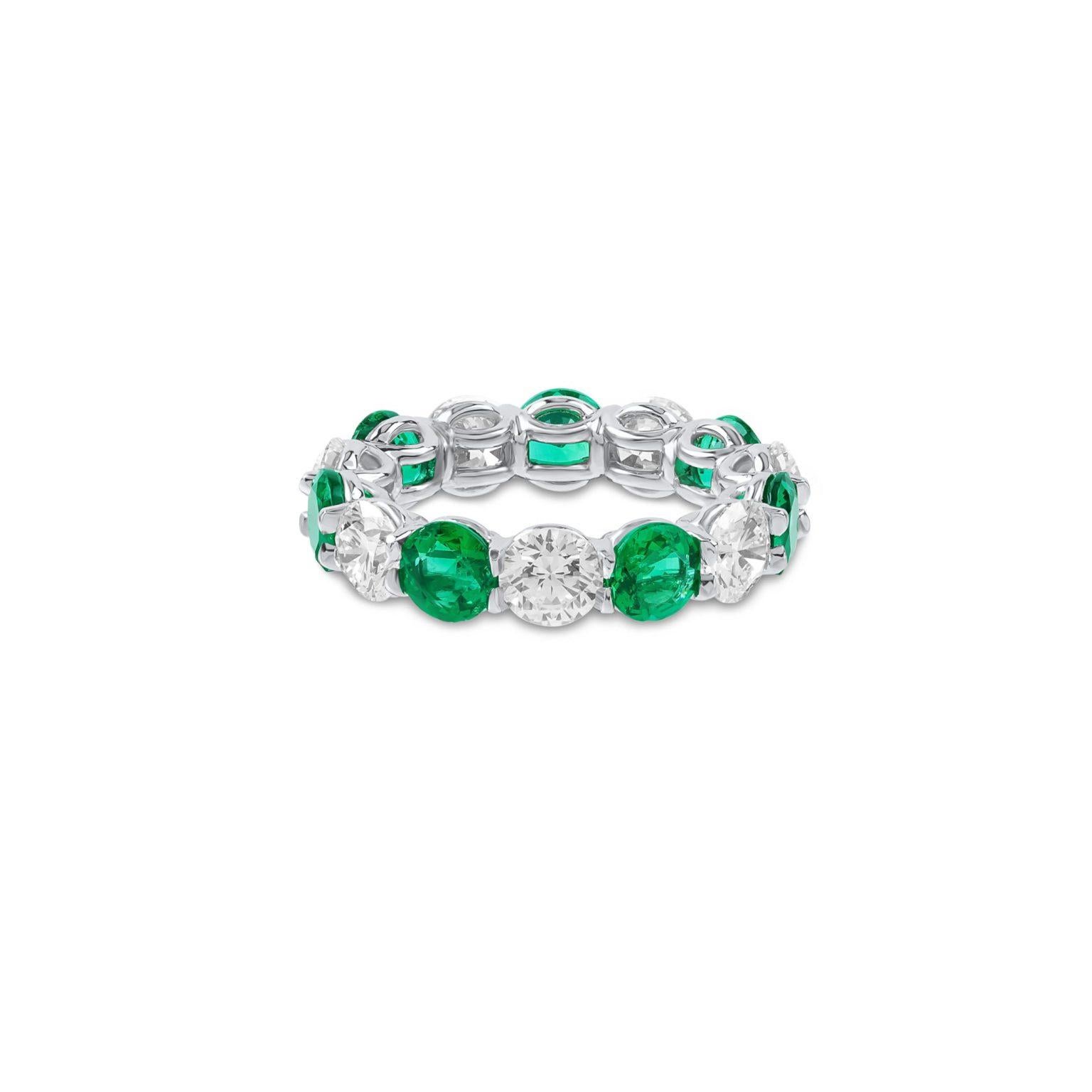 This beautiful Ring features 7 Emeralds alternating with 7 Round Brilliant Diamonds totaling 6.73 Carats.

7 Emeralds weigh 3.21 Carats.
7 Diamonds weigh 3.52 Carats. Certified by GIA as EF color and VS2 vlarity.
Set in Platinum.
Finger Size 5.75