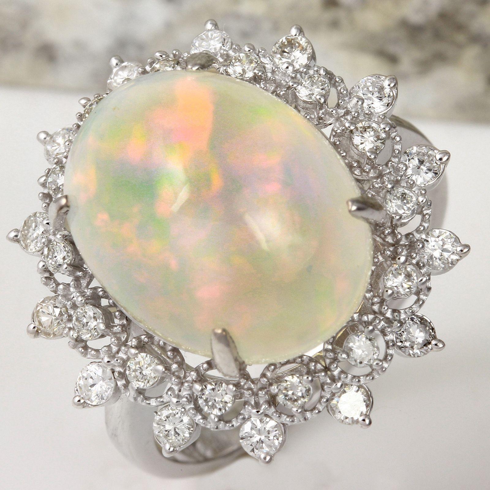 6.73 Carats Natural Impressive Ethiopian Opal and Diamond 14K Solid White Gold Ring

Total Natural Opal Weight is: Approx. 5.73 Carats

Opal Measures: Approx. 15.38 x 12.07mm

The head of the ring measures: Approx. 21.14 x 20.63mm

Total Natural