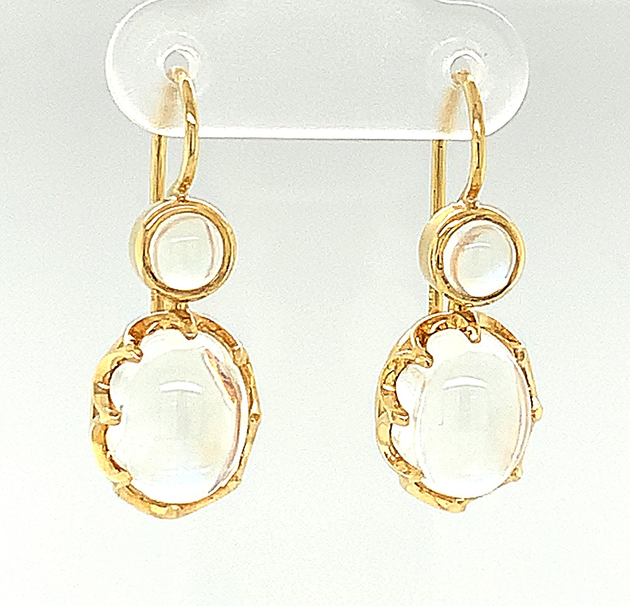 These beautiful drop earrings are subtle and elegant and have a magical quality of light. They feature moonstones that are extremely clean and transparent and display a fine, blue, adularescence, or 