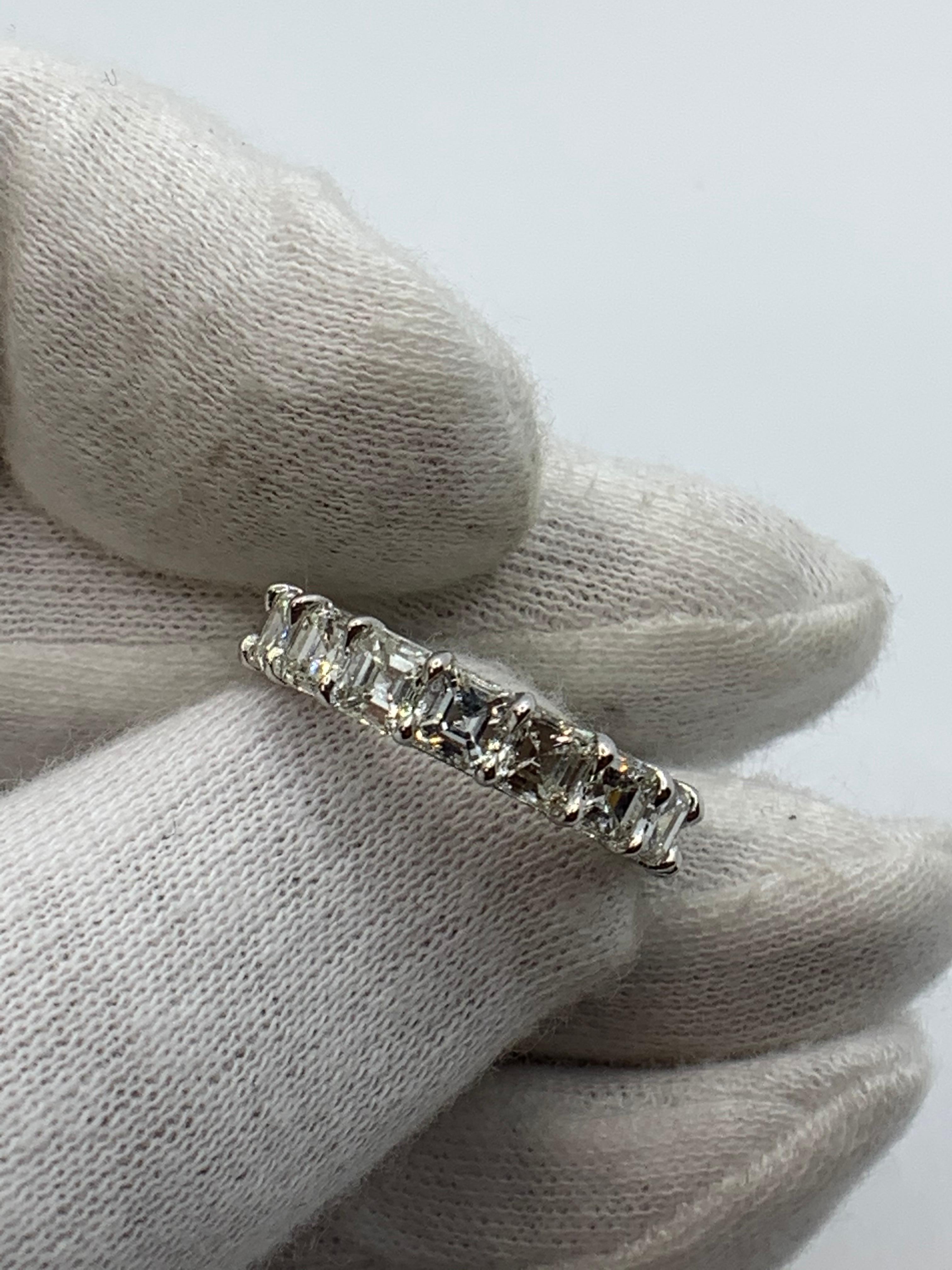 This Beautiful Eternity Band is set with 17 perfectly matched Asscher Cut Diamonds, each weighing over 0.40ct for a total of 6.75 Carats. Each stone is of G-H color and VVS-VS clarity. Made in New York City using Platinum 950. Fits US Size