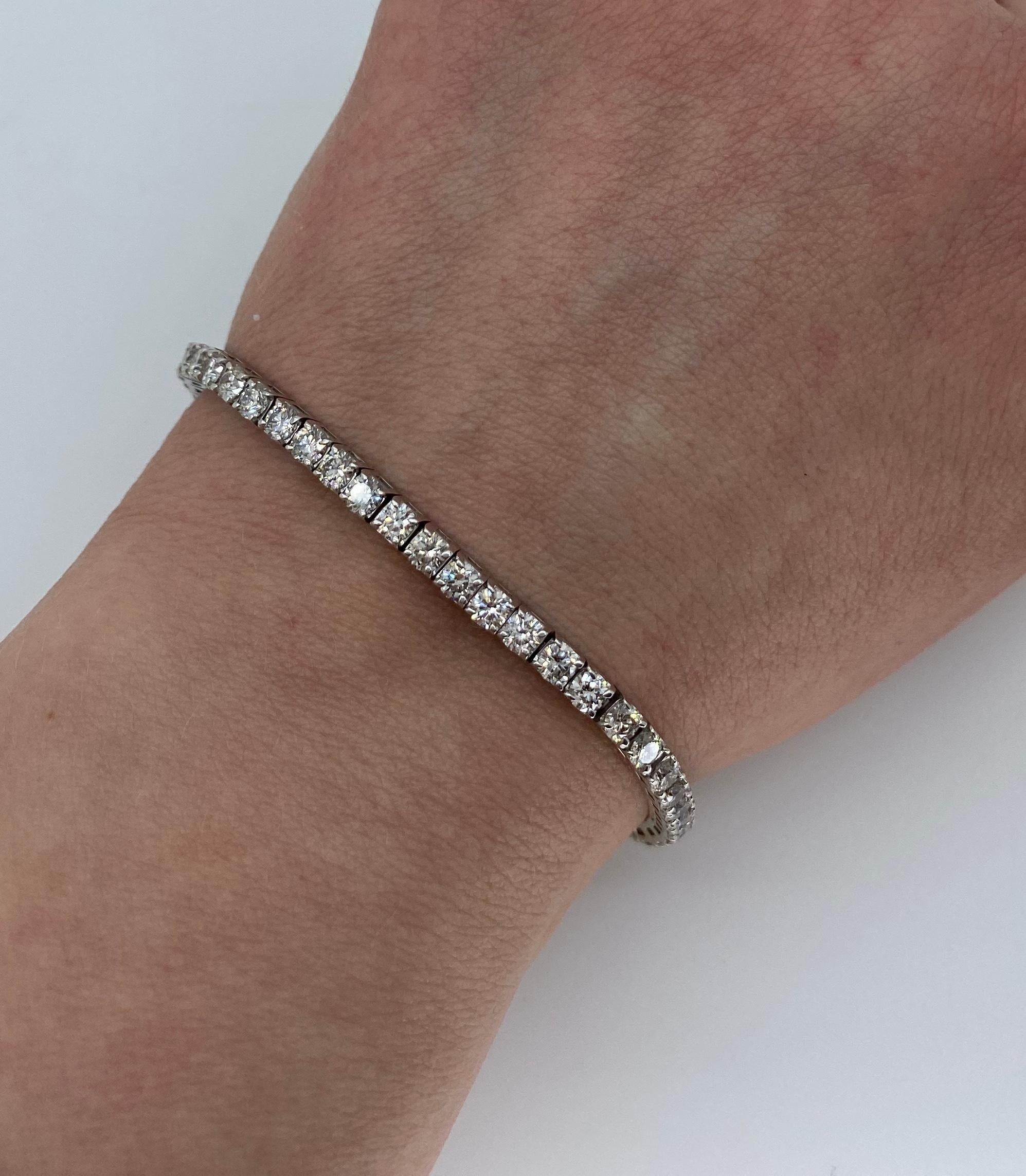 Approximately 6.75CTW diamond tennis bracelet crafted in 14k white gold.

Diamond Carat Weight: Approximately 6.75CTW
Diamond Cut: Round Brilliant Cut 
Color: Average G-J
Clarity: Average SI-I
Metal: 14K White Gold
Marked/Tested: Stamped 