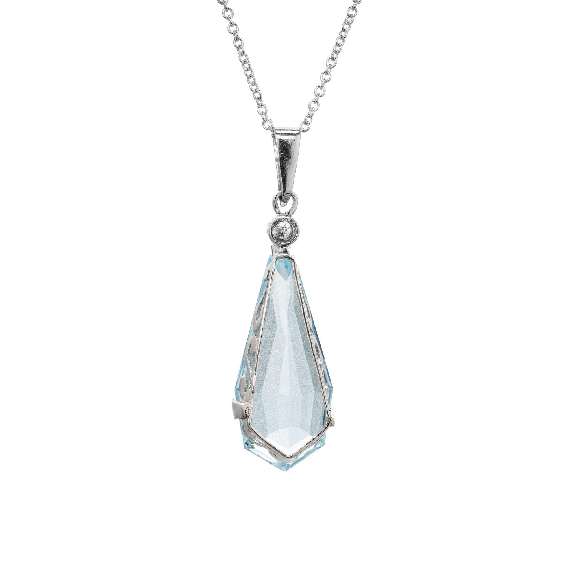 1940's Bright aquamarine and diamond pendant necklace. 6.75ct kite shaped aqua set in a 14k white gold setting with a round cut diamond accent. 18 inch 14k white gold chain. 

1 kite shaped blue aqua, approx. 6.75cts
1 round diamond, I-J SI approx.