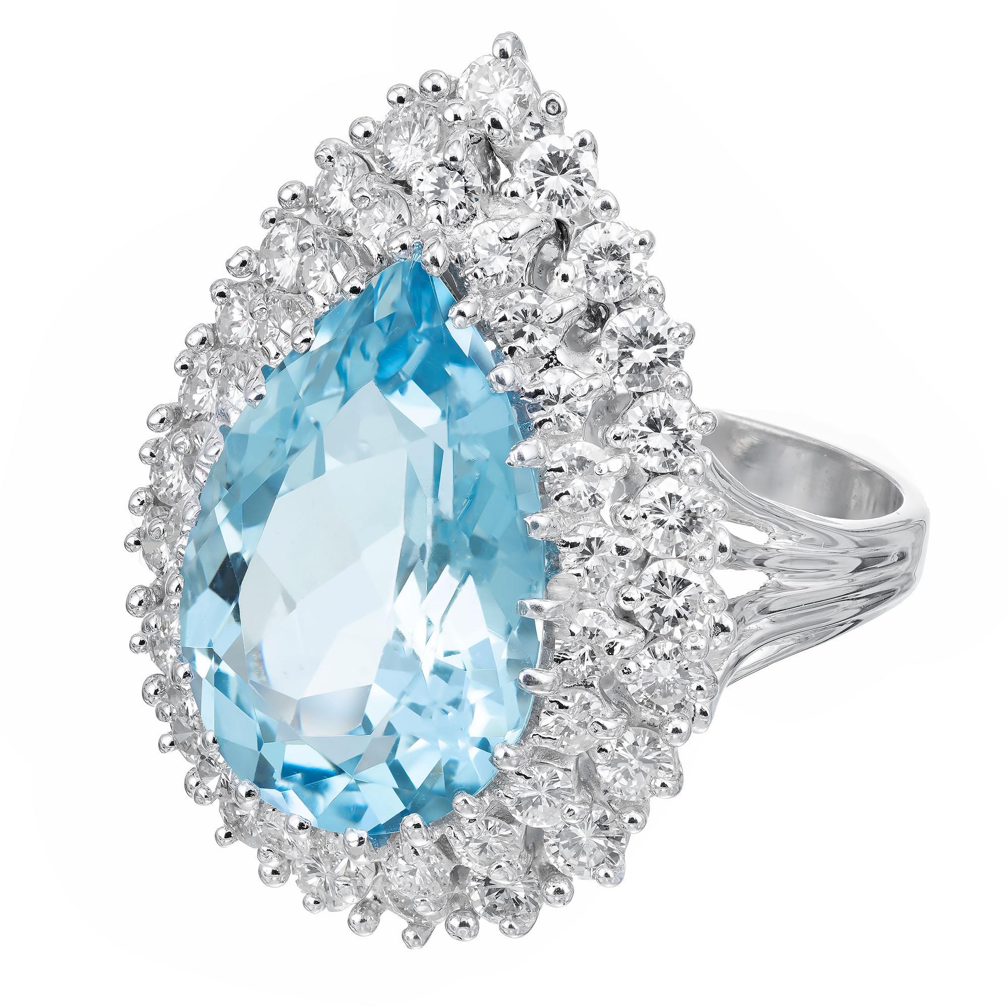 Mid-Century 1960's vintage aqua and diamond ring. 6.75 carat pear shaped bright blue natural aquamarine with a two row halo of bright round cut diamonds in a 14k white gold setting. 

1 pear shaped blue aquamarine, approx. 6.75cts
45 round brilliant