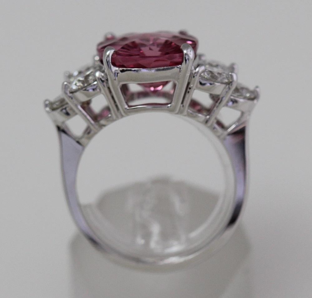 Selling a 6.75 Ct Huge Cushion Natural Pink Spinel & Diamond

1. Carat Weight: 6.75 Carat Spinel

2. Color: Pink

3. Tone:  Medium - Nice, 8.0 Out of 10

4. Hue: Intense Pink.

3. Clarity:  Excellent clarity, no inclusions to the eye. VVS if diamond