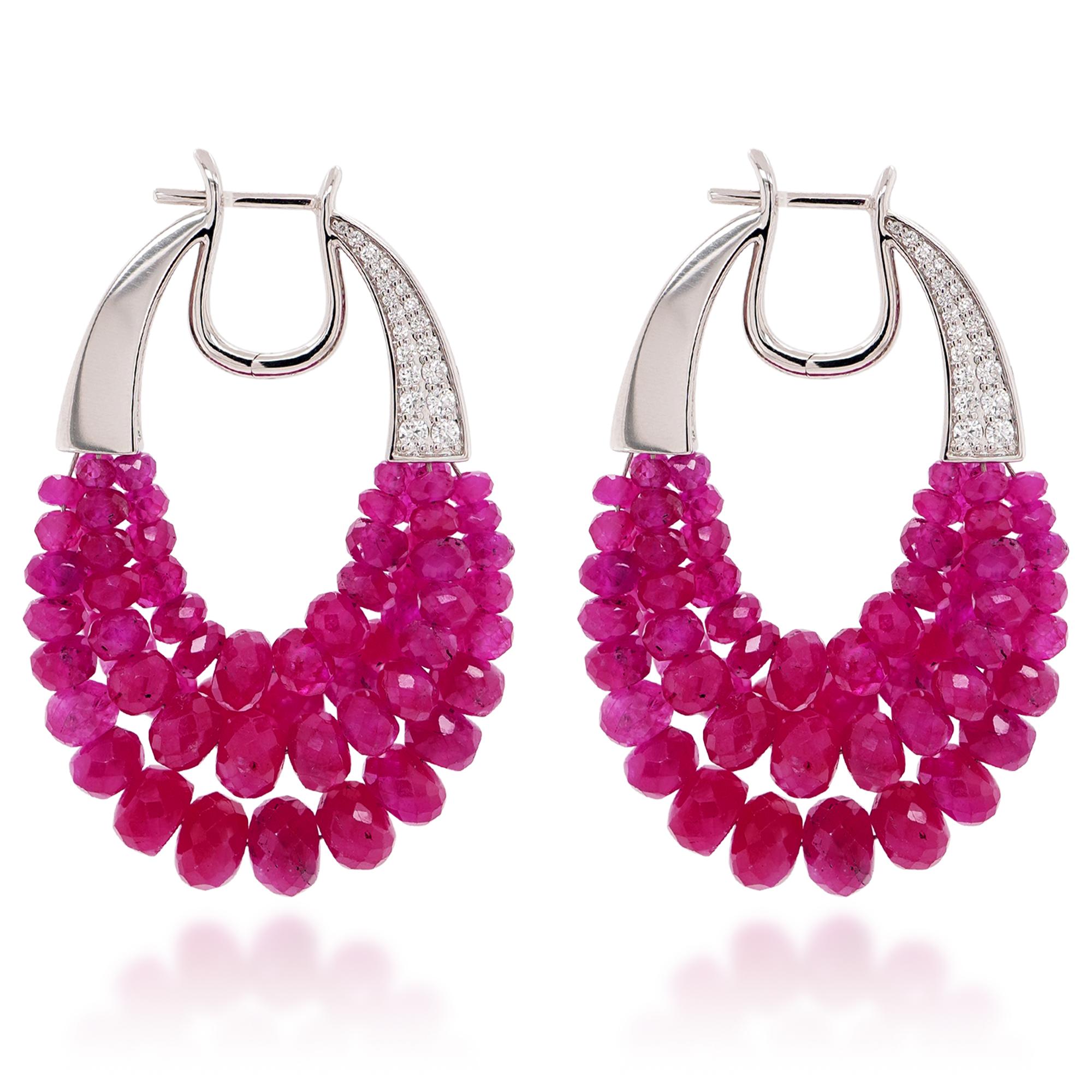 Elevate your elegance with these breathtaking ruby and diamond earrings, a true testament to luxury and sophistication. Featuring an extraordinary 67.68 carats of vivid, richly colored rubies, these earrings exude timeless beauty and unparalleled