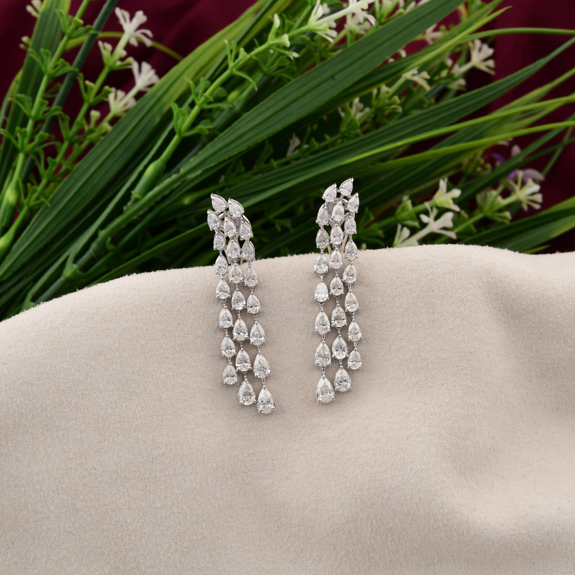 Experience the allure of these magnificent pear-shaped diamond earrings, featuring a total of 6.77 carats of brilliant cut diamonds. Set in luxurious 18 karat white gold, these earrings exude elegance and sophistication, making them the perfect