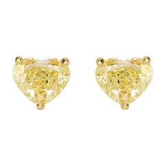 6.77ct Fancy Light Yellow Heart Shaped Diamond Stud Earrings