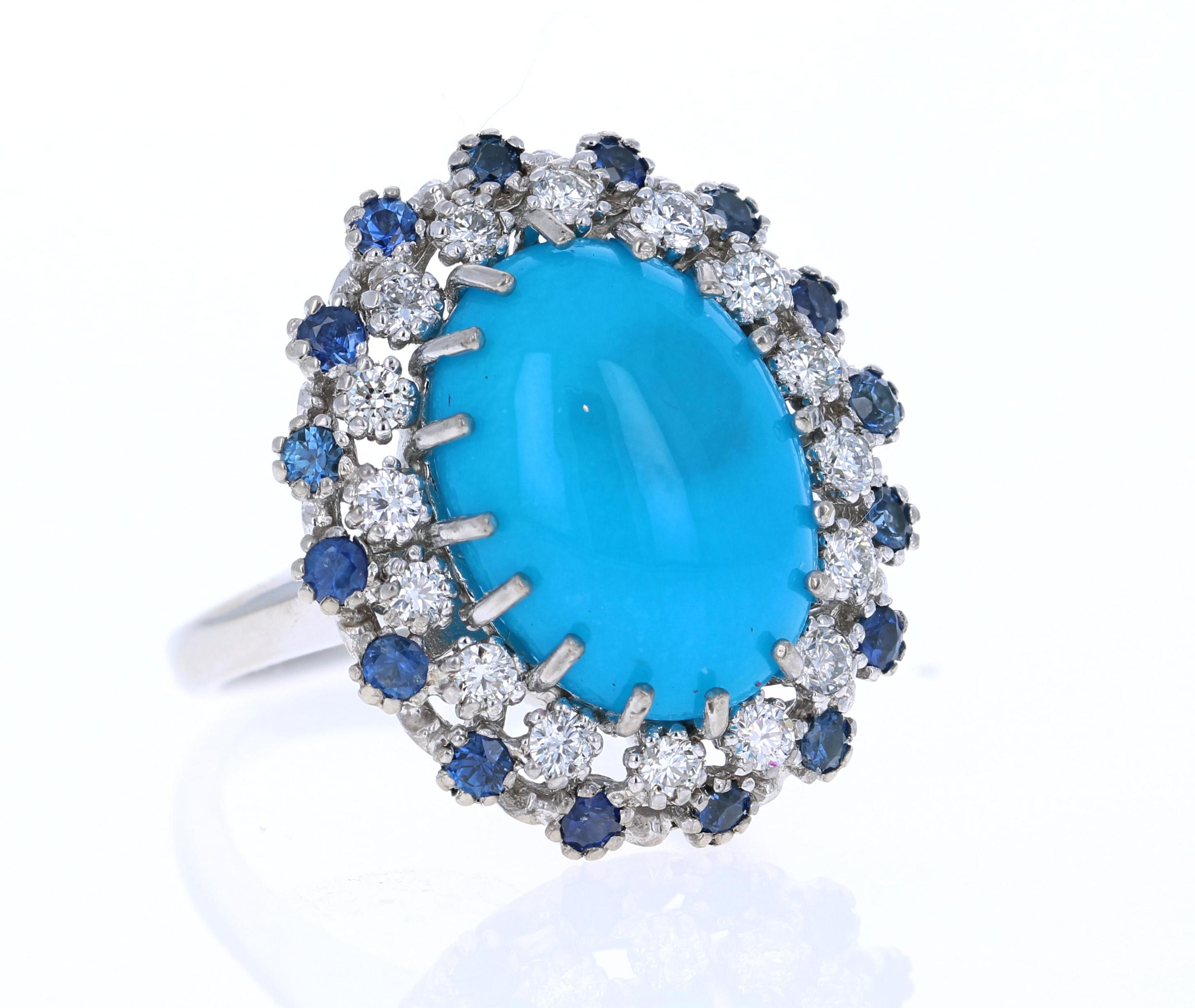 GIA Certified Beautiful Turquoise Diamond Cabochon Cocktail Ring!

The Oval Cut Natural Double Cabochon Turquoise is 8.31 Carats and has a halo of 10 Round Cut Diamonds weighing 0.37 Carats (Clarity: SI, Color: F) and 10 Round Cut Blue Sapphires