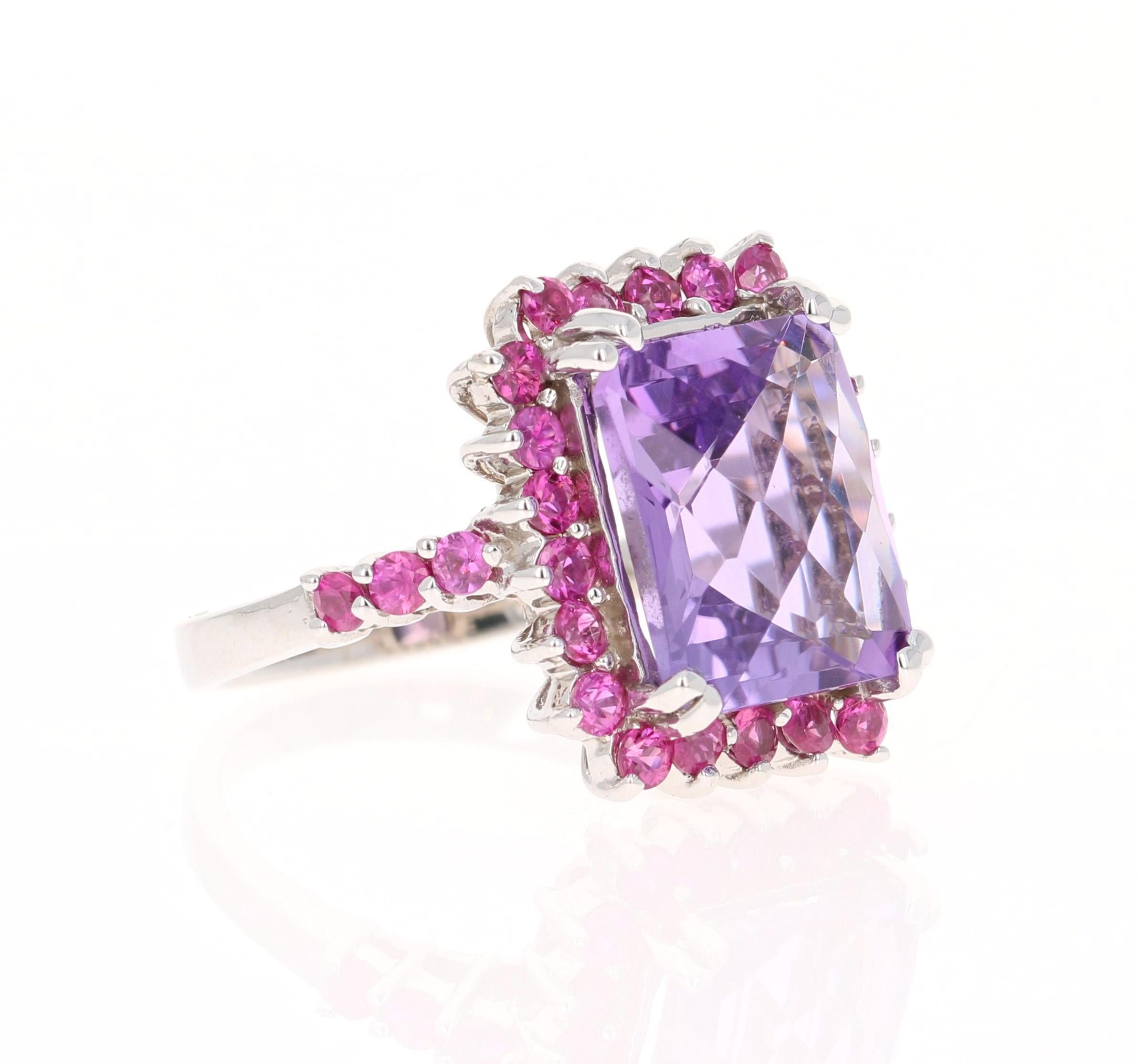 This ring has a beautiful Emerald Cut Amethyst that weighs 5.57 carats and 28 Pink Sapphires that weigh 1.22 carats. The total carat weight of the ring is 6.79 carats. 
The ring is crafted in 14 Karat White Gold and weighs approximately 5.9 grams.