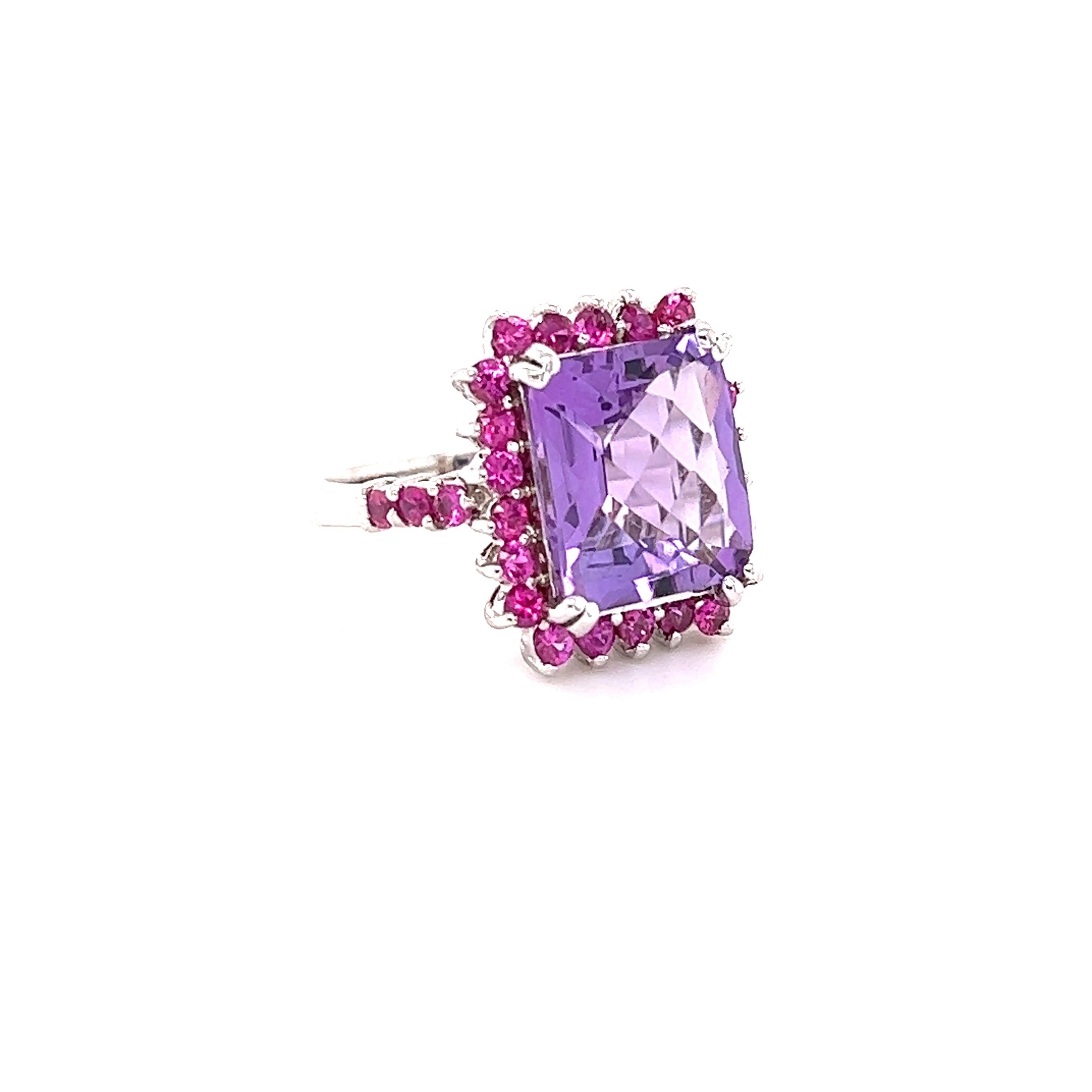This ring has a Emerald Cut Amethyst that weighs 5.57 carats and it has 18 Pink Sapphires that weigh 1.22 carats.
The total carat weight of the ring is 6.79 carats. 

Curated in 14 Karat White Gold and weighs approximately 5.9 grams. 

The ring is a