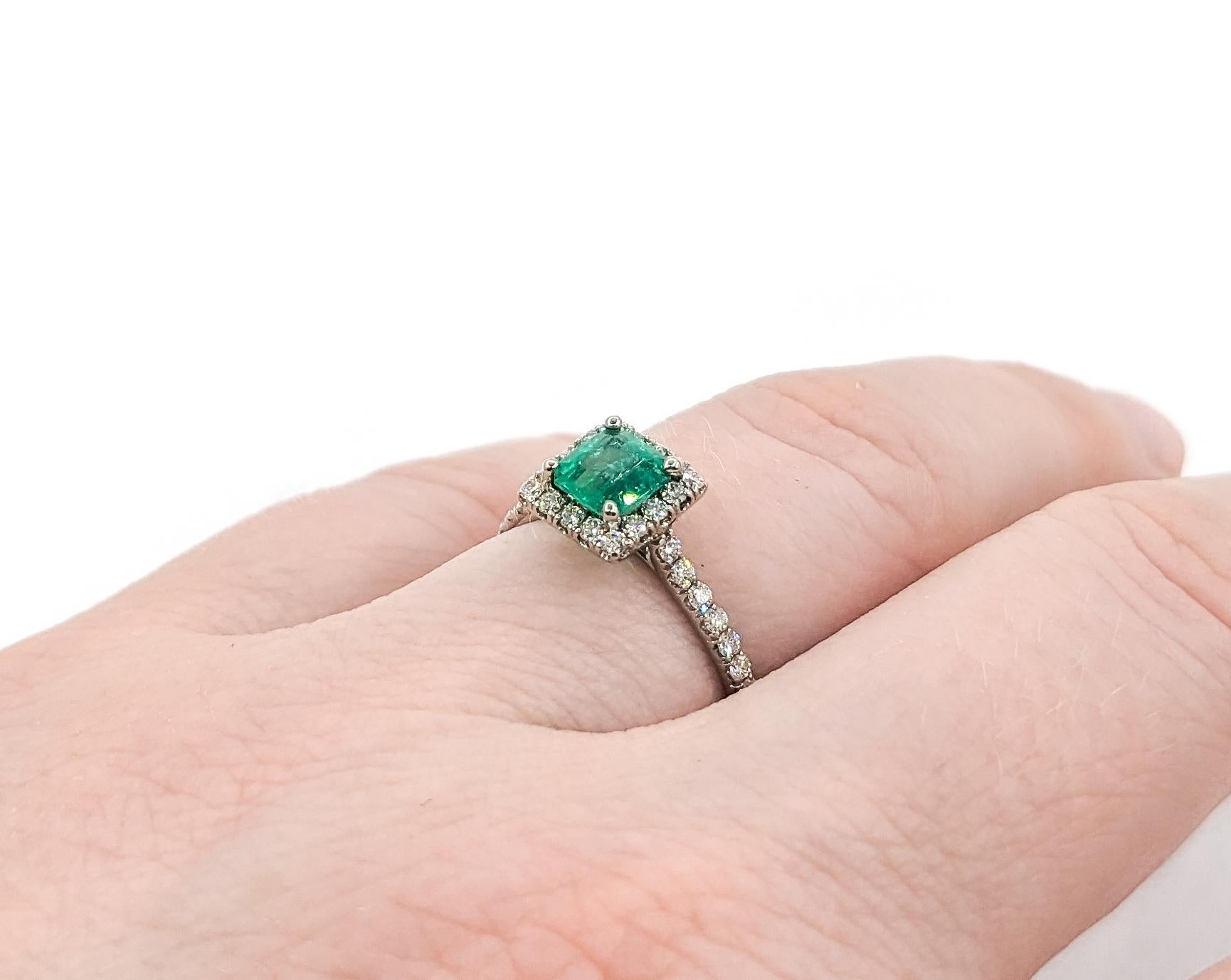 Contemporary .67ct Colombian GIA Emerald & Diamond Halo Ring In White Gold For Sale