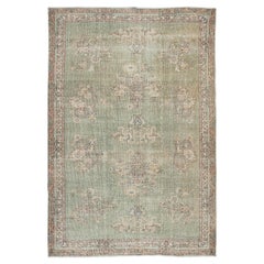 Tapis turc vintage à motifs floraux fait à la main dans des tons de vert 6,7x10 Ft