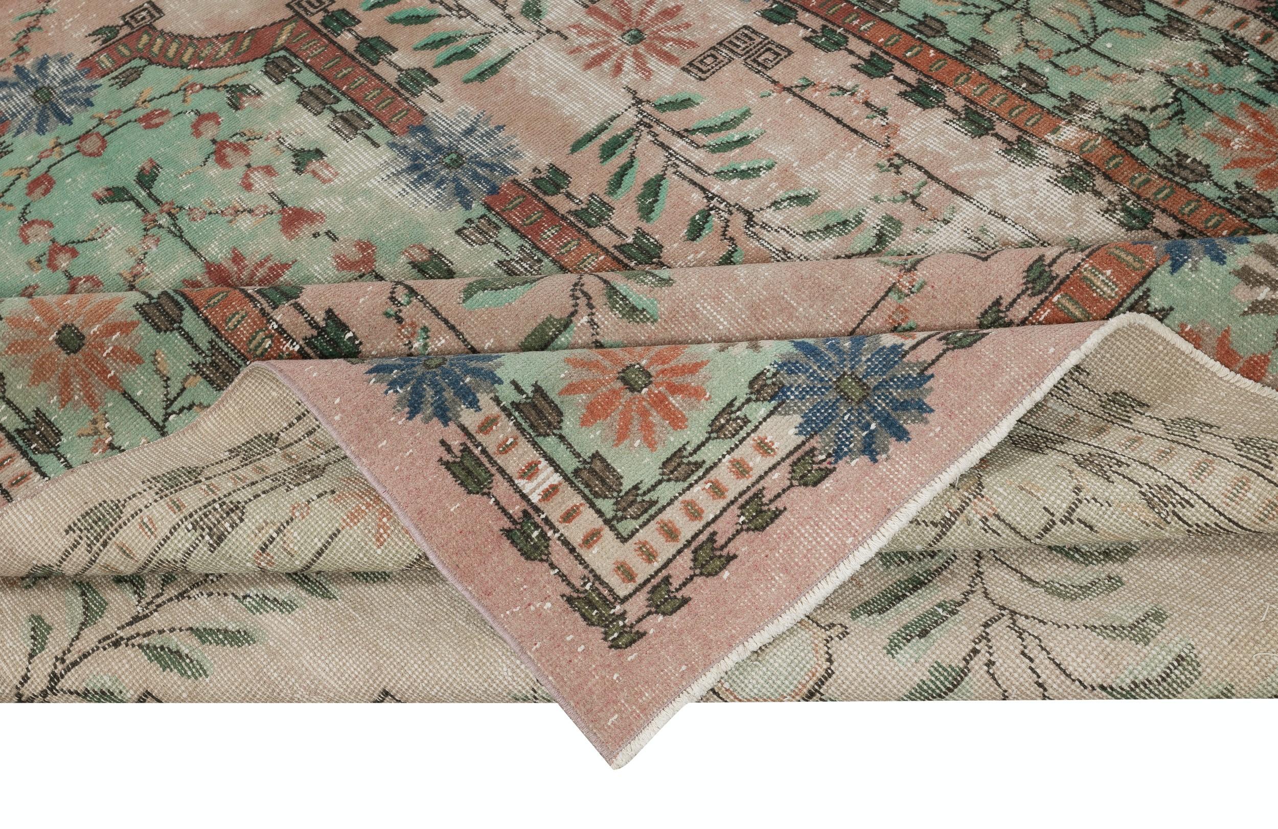 Rustic 6.7x10.5 Ft Hand knotted Rug in Pink and Green. One of a kind Vintage Carpet For Sale