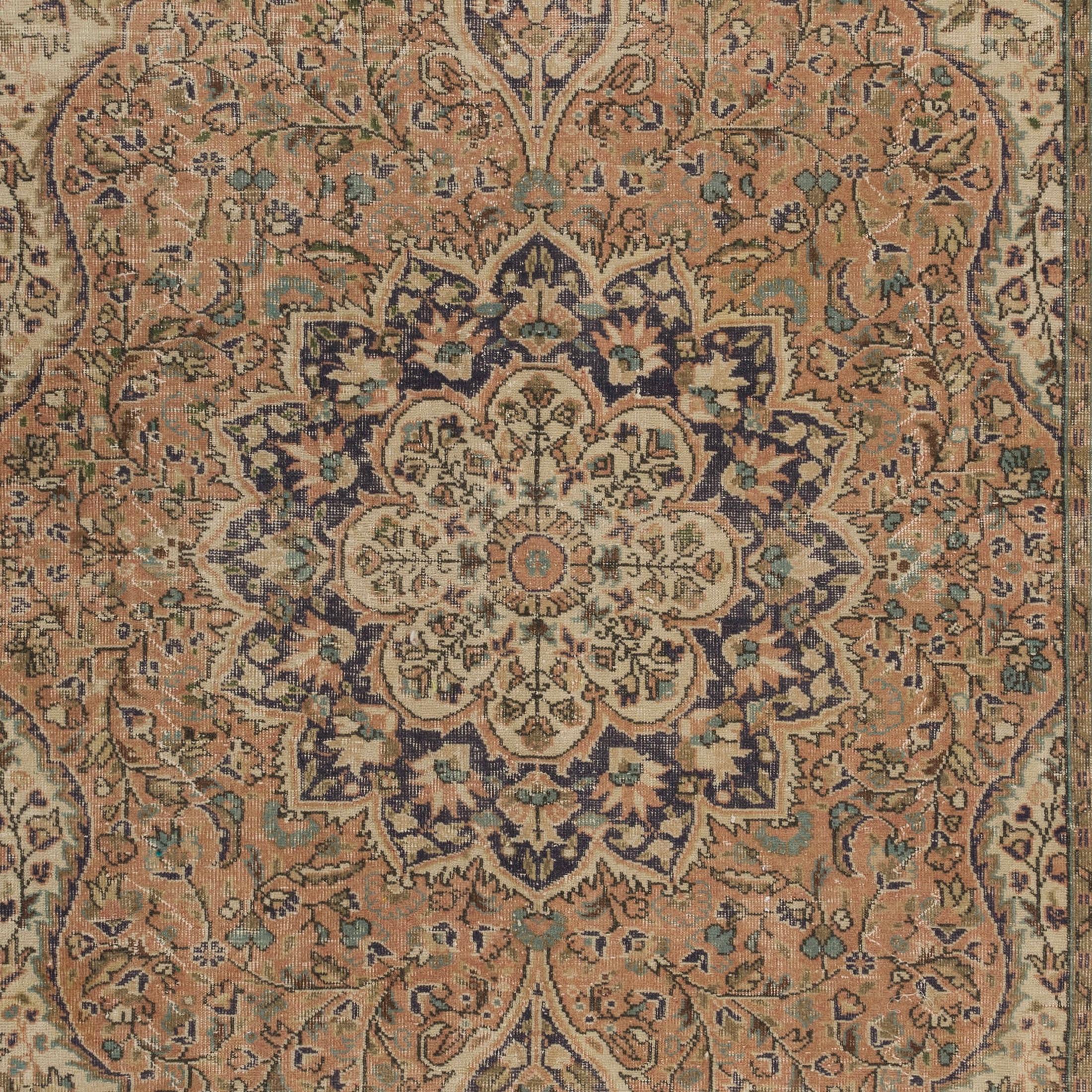 A finely hand-knotted, intricately decorated vintage Turkish Oushak area rug from the 1960s featuring an elegant medallion and lush scrolling vines inside nested curvilinear frames, in faded rose, beige, sand, indigo blue and ice blue. Size: 6.7 x