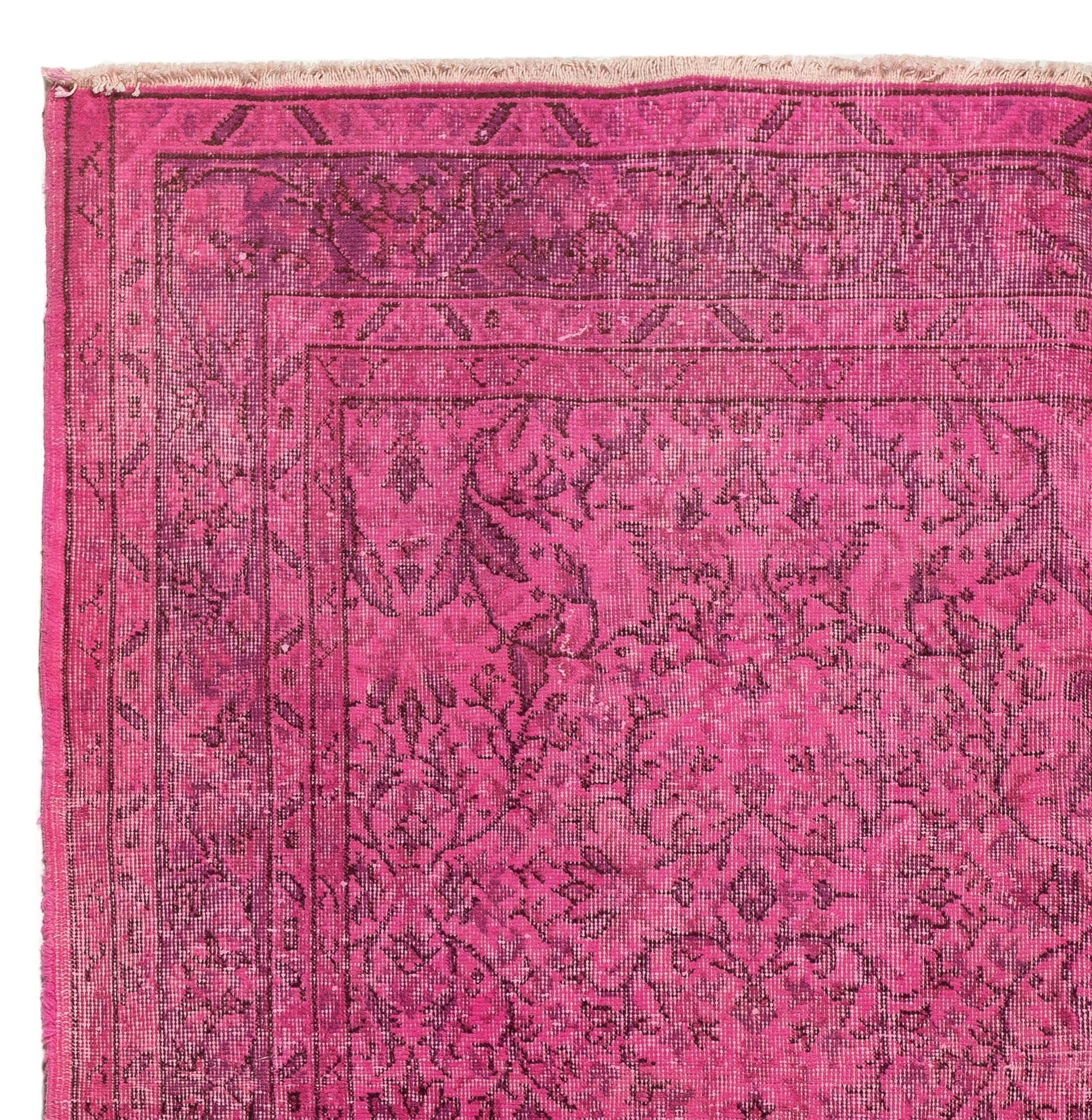 A vintage Turkish area rug re-dyed in pink color for contemporary interiors. 
Finely hand knotted, low wool pile on cotton foundation. Professionally washed.
Sturdy and can be used on a high traffic area, suitable for both residential and