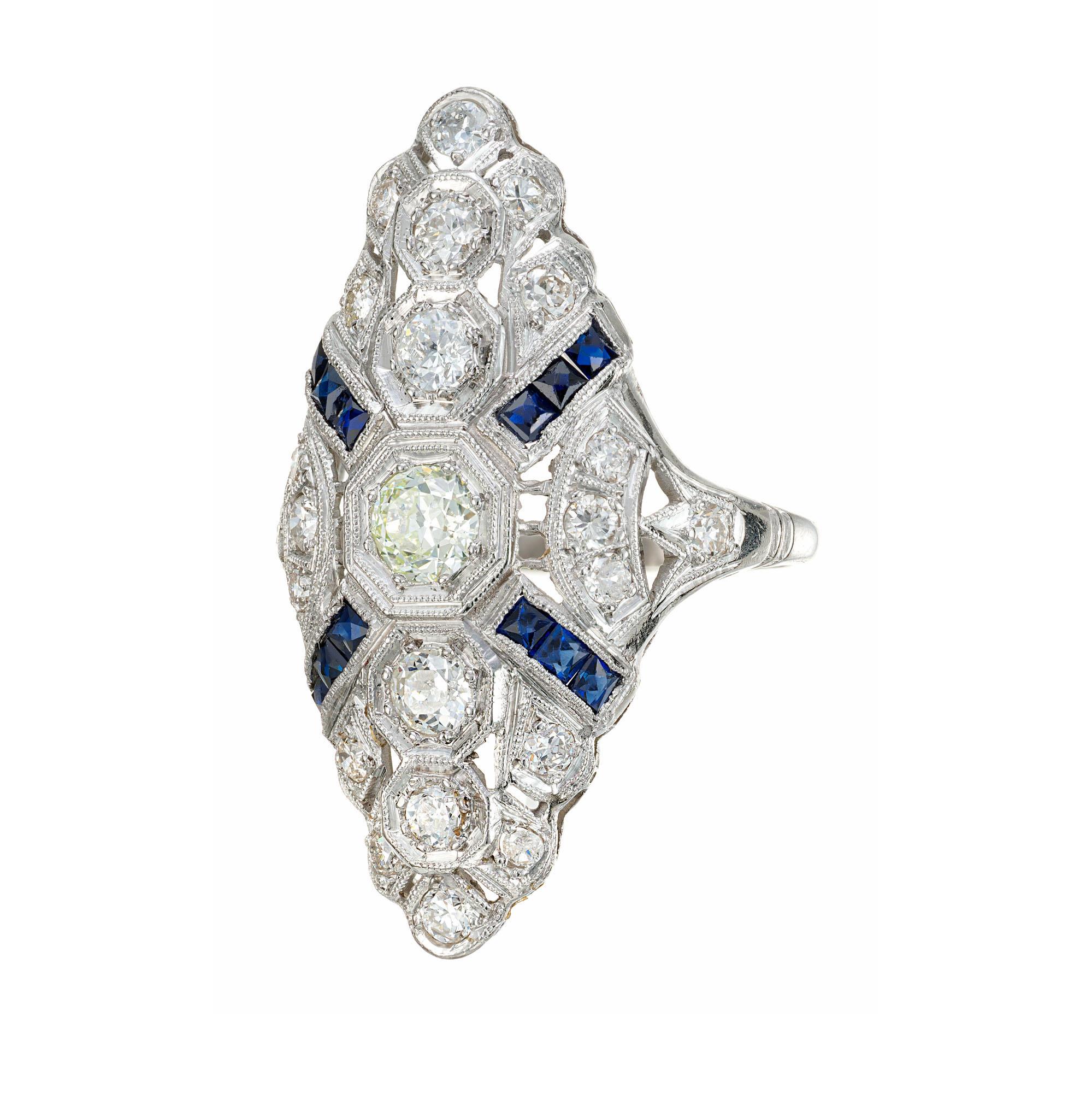 Marquise shaped 1940's filigree shape platinum cocktail ring with 23 round European cut diamonds and 12 French cut sapphires. 

23 round European cut diamonds, H-I SI approx. .68cts
12 French cut blue sapphires, approx. .25cts
Size 7 and