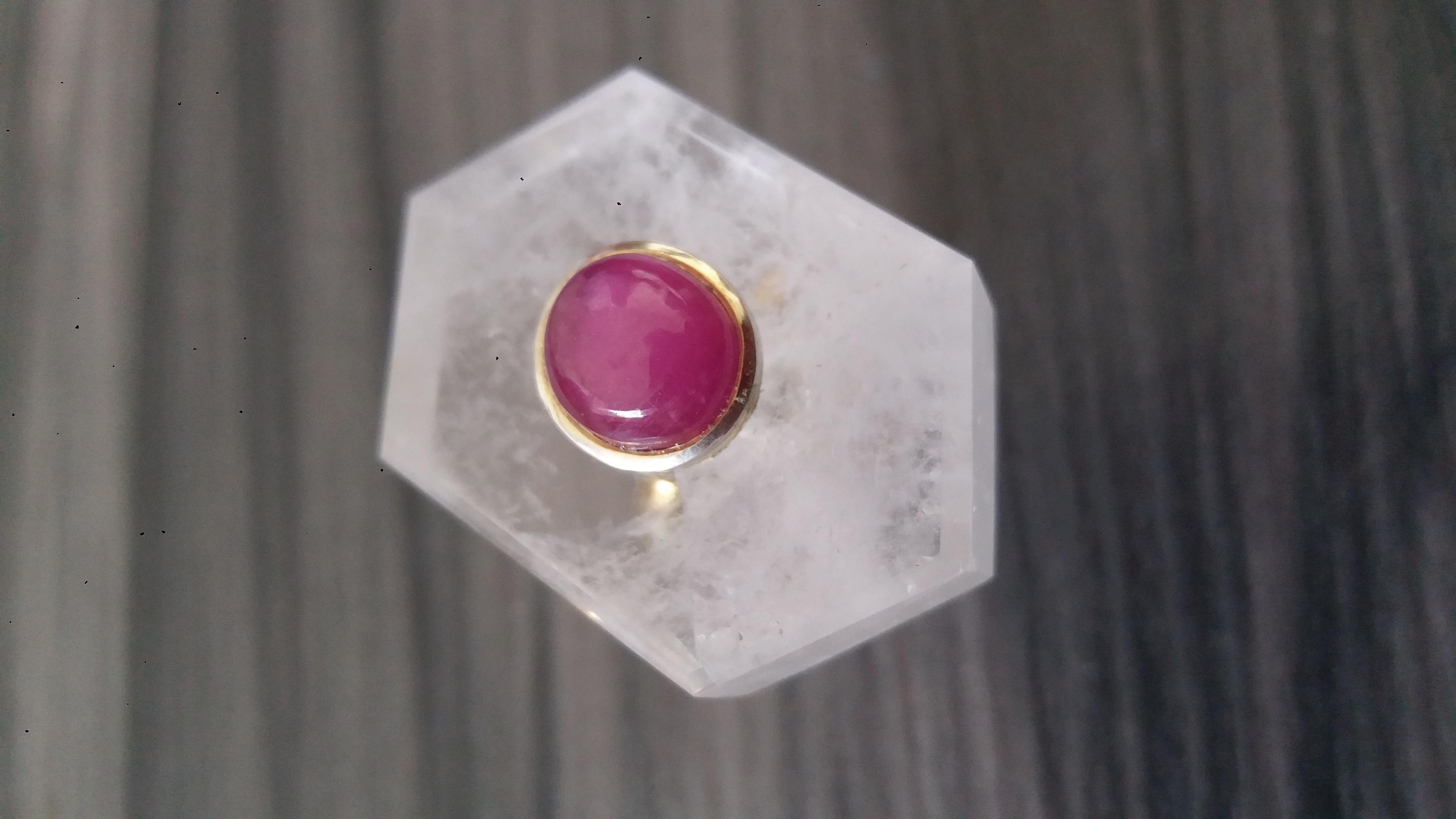 Unique ring with an Hexagon shape Natural  Rock Crystal (Quartz) ,measuring 32 mm. x 22 mm x 10 mm. and weighing 68 Carats with a nice Oval Ruby Cabochon measuring 8 mm x 10 mm set in 14 kt yellow gold...Ring shank is also in 14 kt  solid yellow