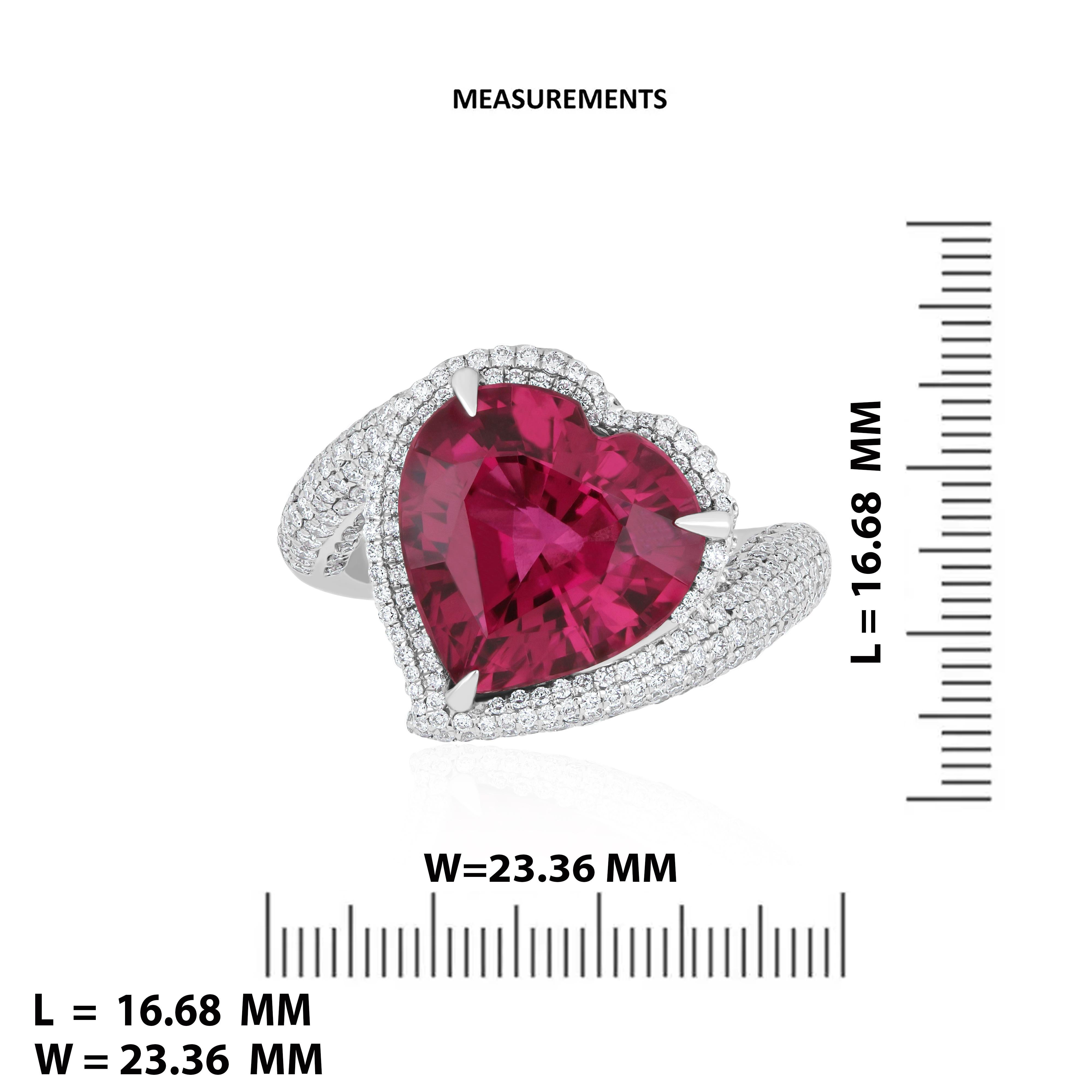 Elegant and exquisitely detailed 18K White Gold Ring, with 6.8 Cts Heart Shape Rubellite set in center and Surrounded by Micro pave Diamonds, weighing approx. 1.1 CT's. total carat weight to further enhance the beauty of the ring. Beautifully Hand