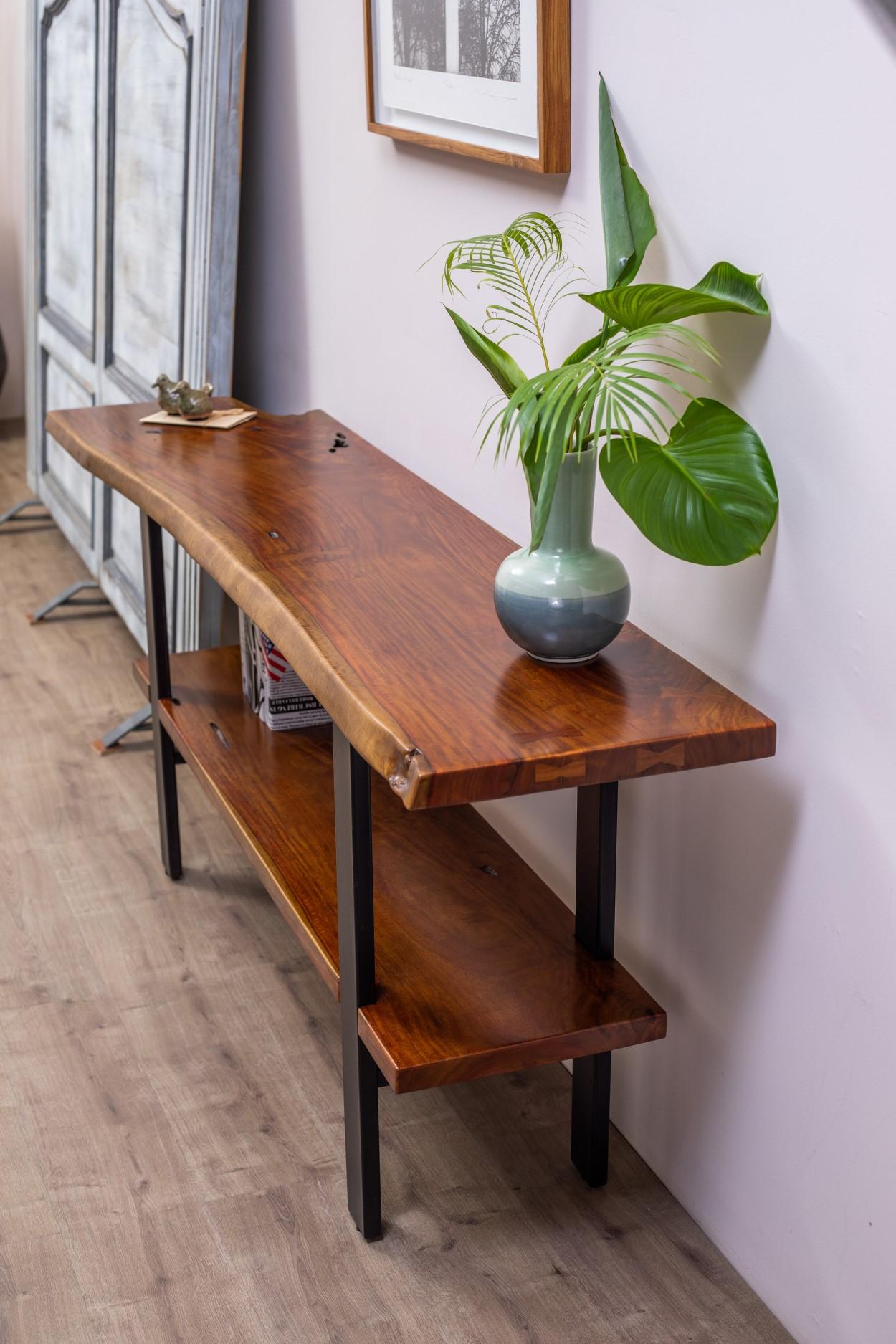 A true one-of-a-kind piece, this rare find Rosewood live edge slab has been handcrafted into a beautiful two-tiered console table 68