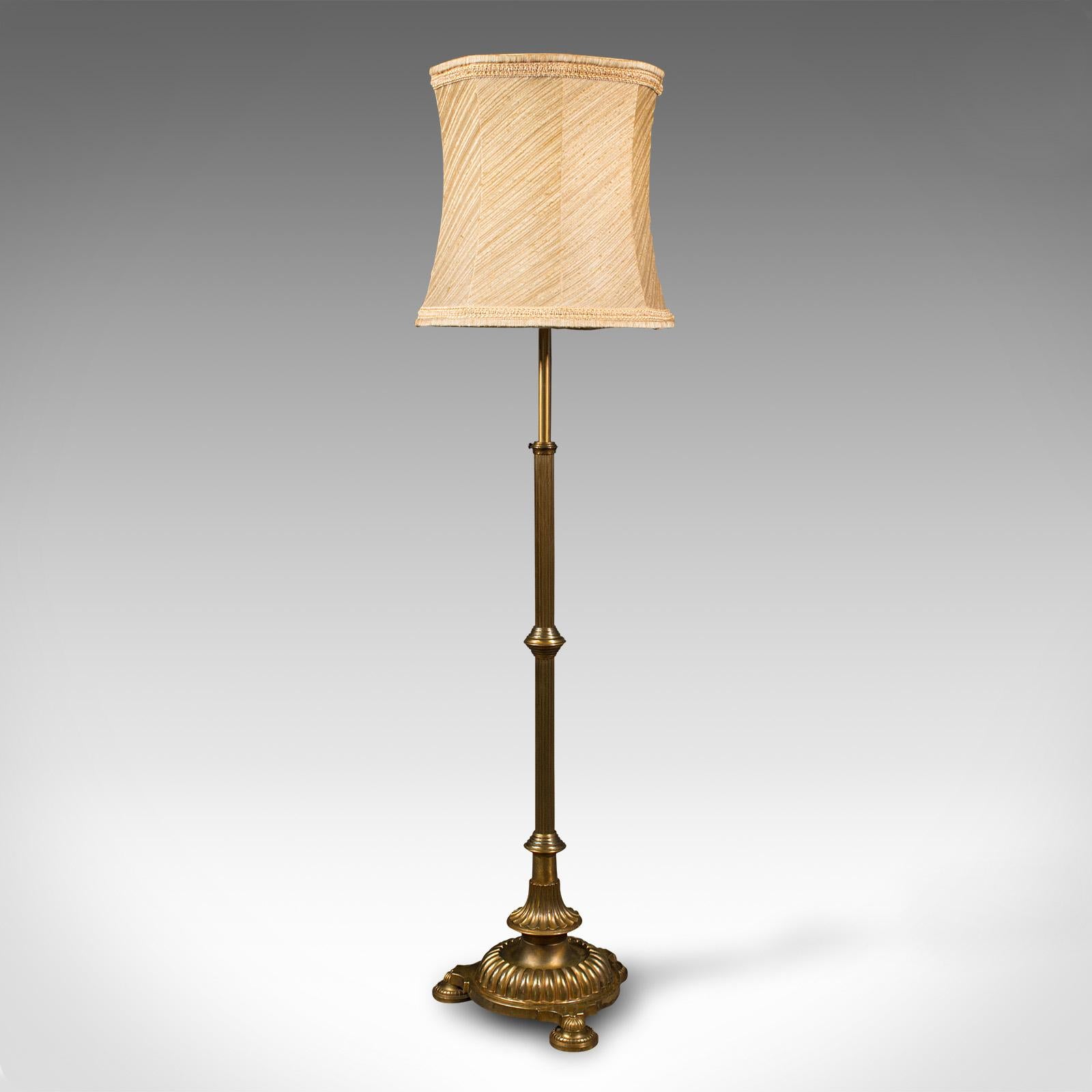 This is a tall vintage standard lamp. An English, heavy brass adjustable reading light, dating to the mid 20th century, circa 1940.

Top quality, superb size and alluring finish
Displays a desirable aged patina throughout
Striking brass offers