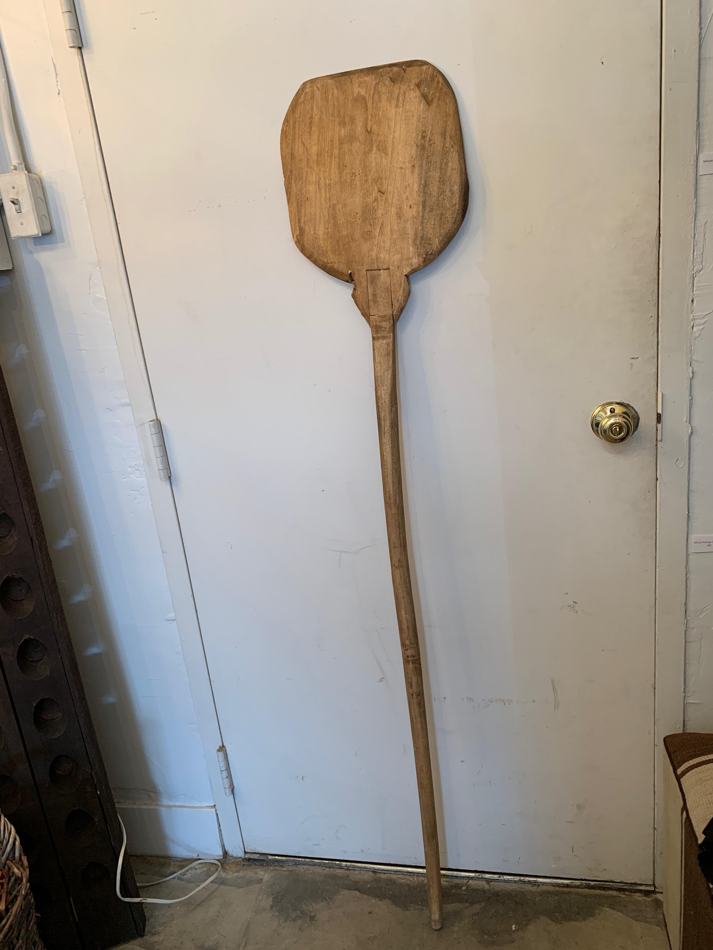 This vintage wooden baking paddle, originally from Europe, is perfect for putting homemade pizza or bread into a wood fired outdoor oven. Its rustic design connects you to a past of bread making, going back thousands of years. Also a wonderful