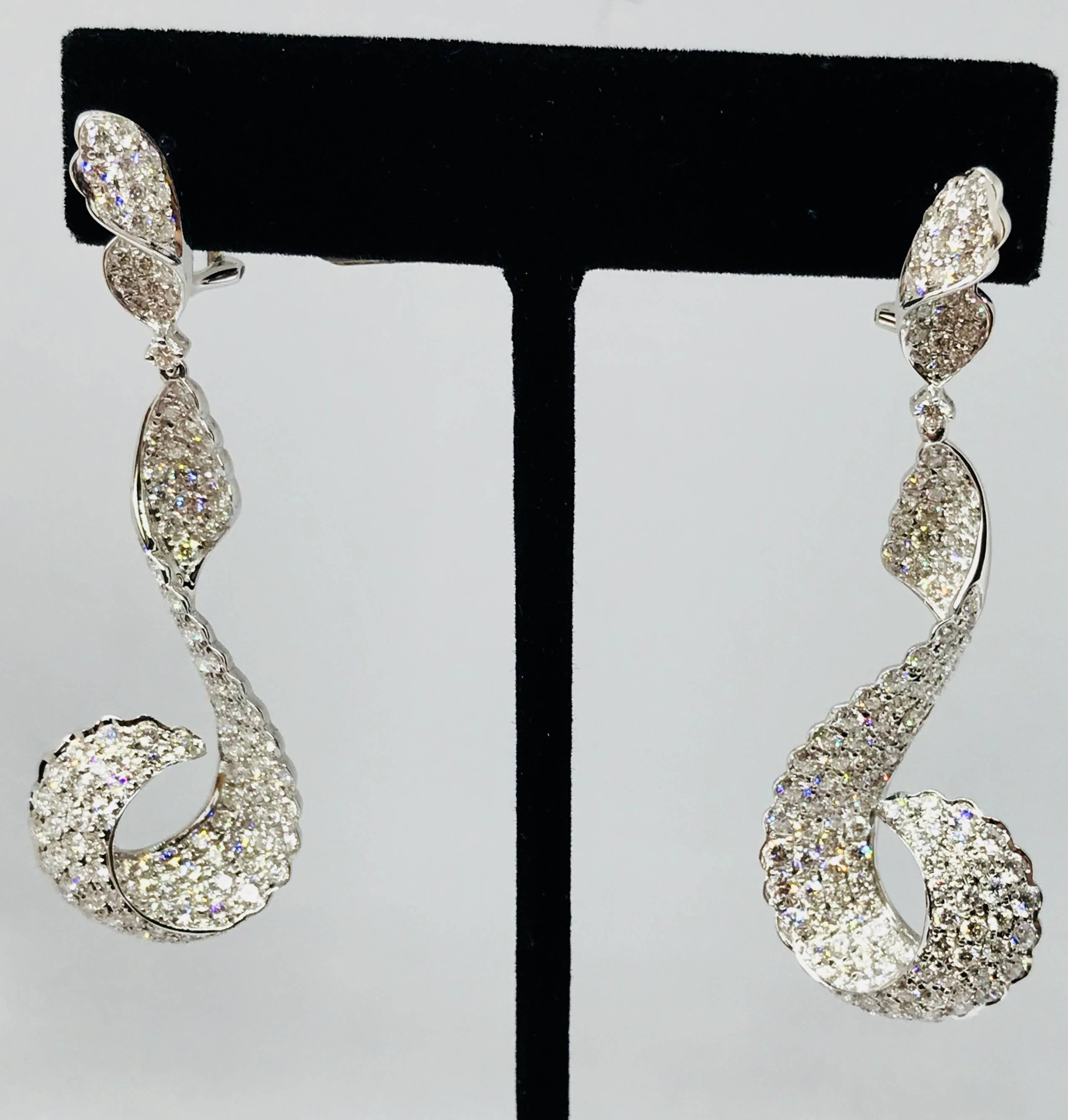 Most exclusive one of a kind Diamond earring .
Hand Crafted and Designed by Top designer . 
stunning over evening gown and high end party 
18 kt White Gold 13.96 grams
VVS F Diamonds 286 Stones 6.80 Carats 