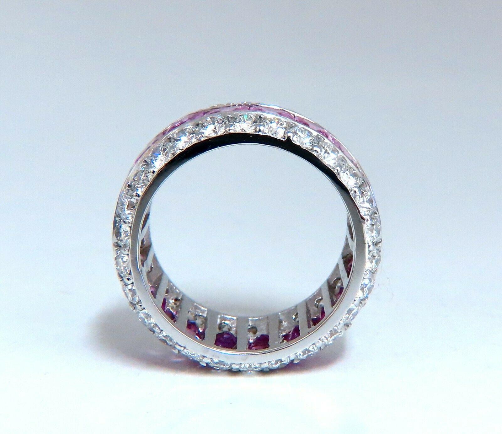 Pink Sapphire Eternity Revolver Band

6.80ct. Princess cut Natural Pink Sapphires & 

 3.60ct diamonds ring.

Sapphires:

Clean Clarity & full square emerald cuts.

Transparent & Vivid Pink colors.

Average: 4.4mm each 

Natural round brilliant