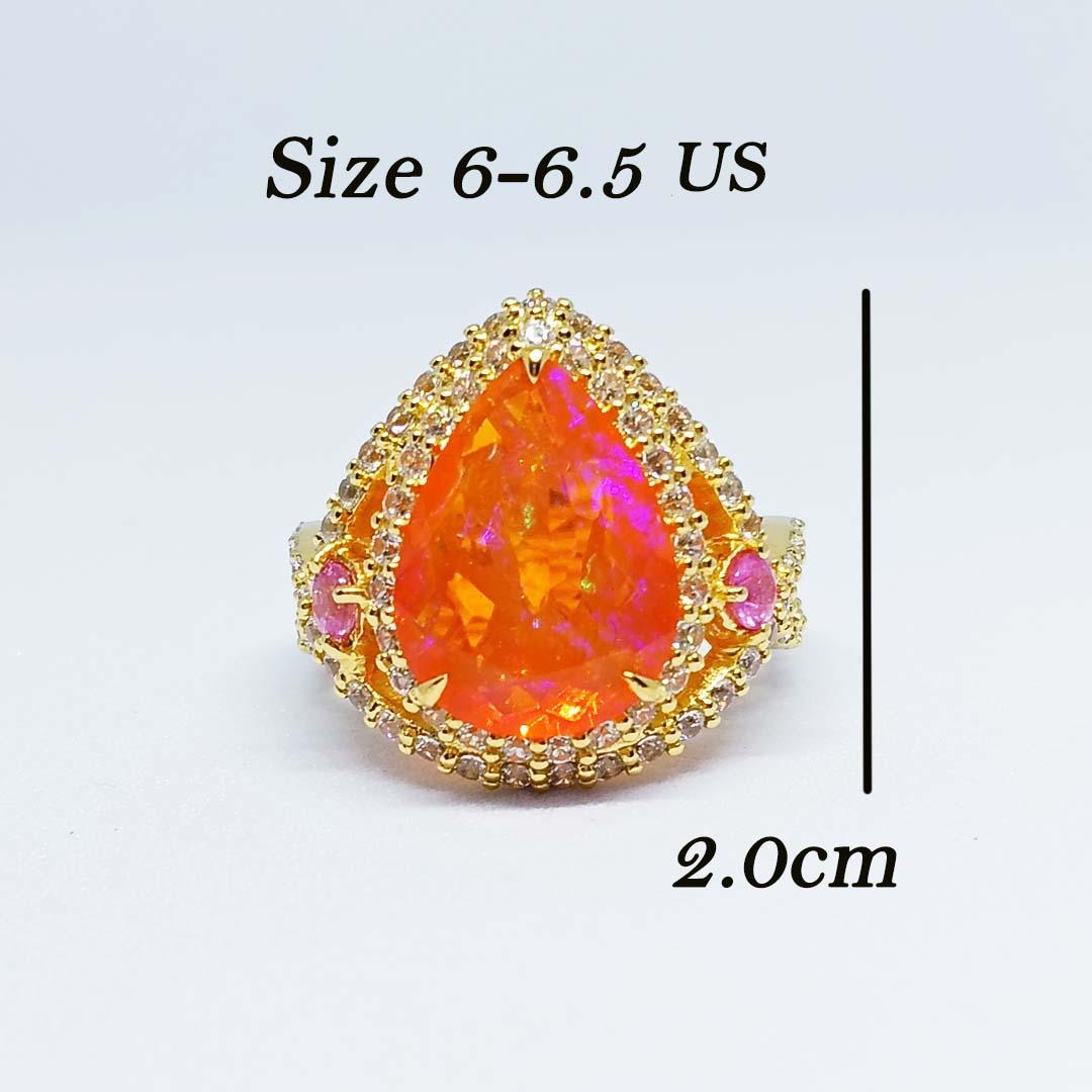 Orange opal Pear 14.7x10.9mm. 6.82 cts.
Pink Sapphire 3 mm 2pcs.
White Zircon 1.5 mm. 85 pcs.
Sterling Silver on 18K Gold Plated.

Size ring 6.5-7 us.