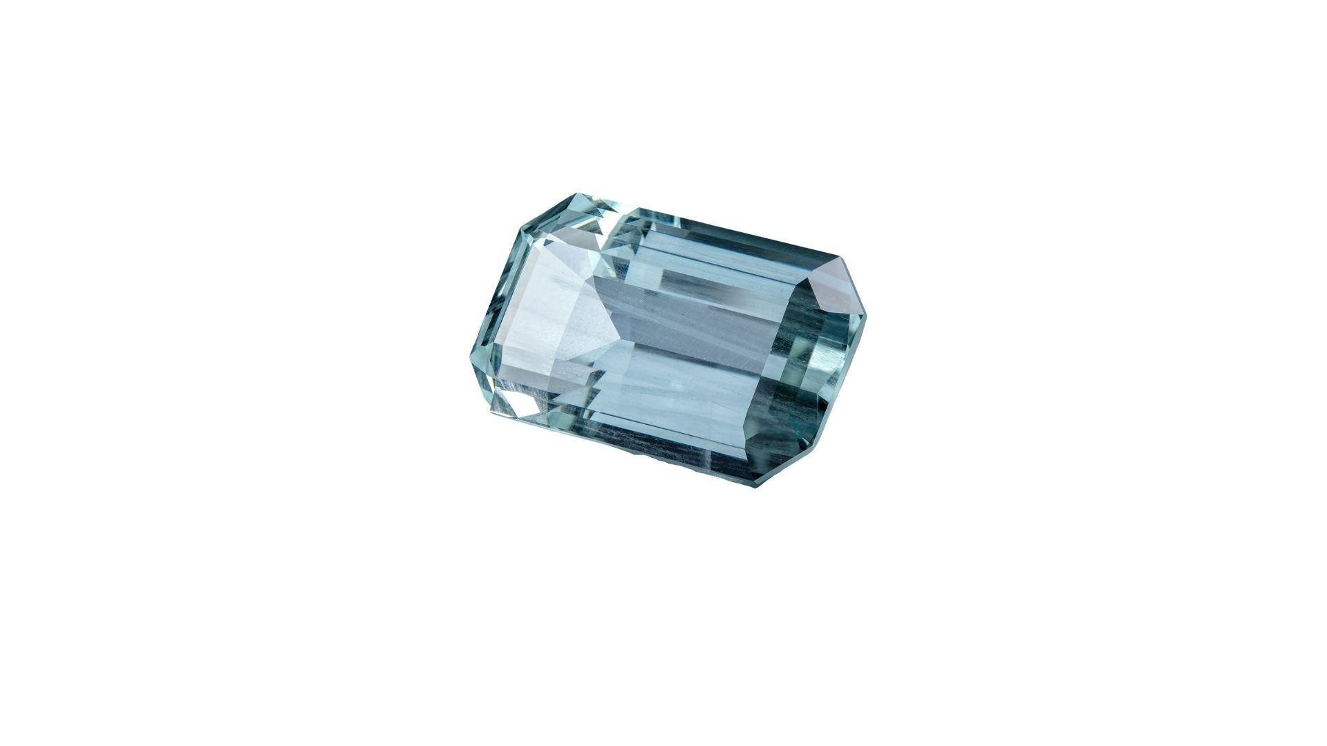 68.29 carats in weight     
19.1 x 33.6 x 14.7 mm in size    
Very Light green blue hue   
Good colour quality     
Eye-clean clarity   
Lightly - moderately included 
50 % brilliance, 30 % window, 20 % extinction  
