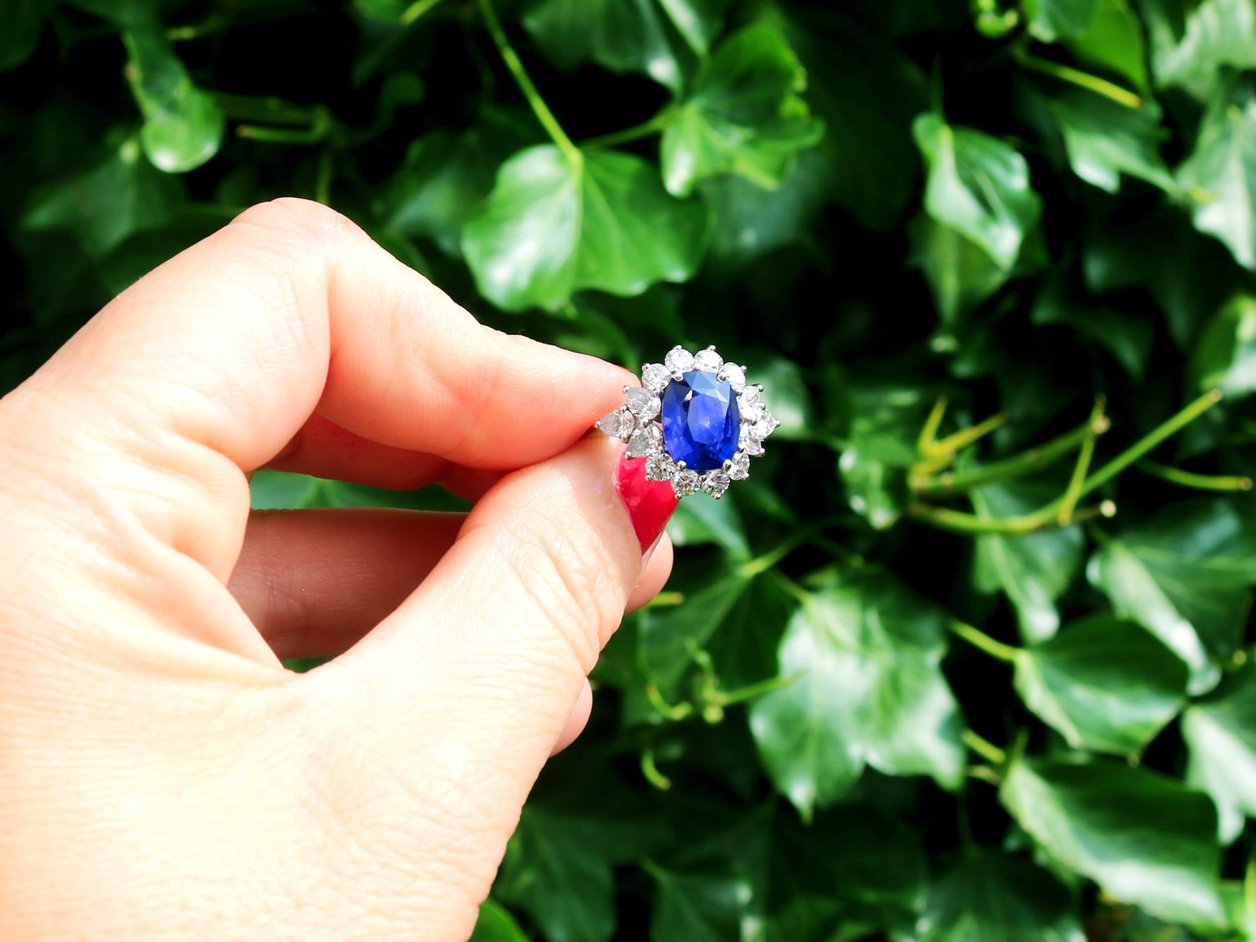 A stunning, fine and impressive vintage 6.83 carat Ceylon sapphire and 2.84 carat diamond, platinum cluster style dress ring; part of our diverse vintage jewelry and estate jewelry collections.

This stunning, fine and impressive vintage sapphire