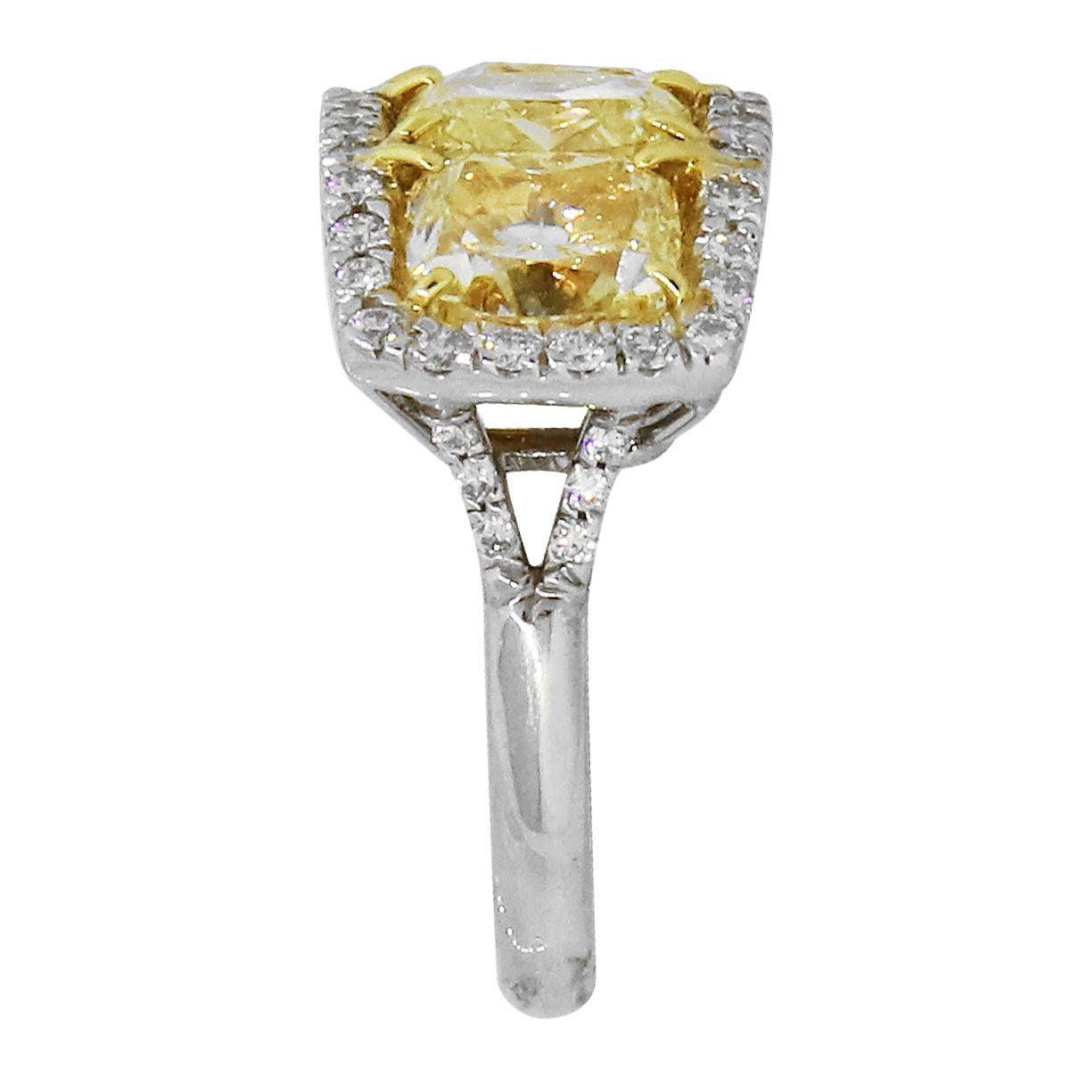Material: 18k Yellow Gold and Platinum
Diamond Details: Approximately 6.83ctw Cushion cut diamonds and Approximately 0.54ctw Round Brilliant Diamonds. Round Diamonds are G/H in color and SI in clarity 
Ring Size: 6.5
Total Weight: 12.1g