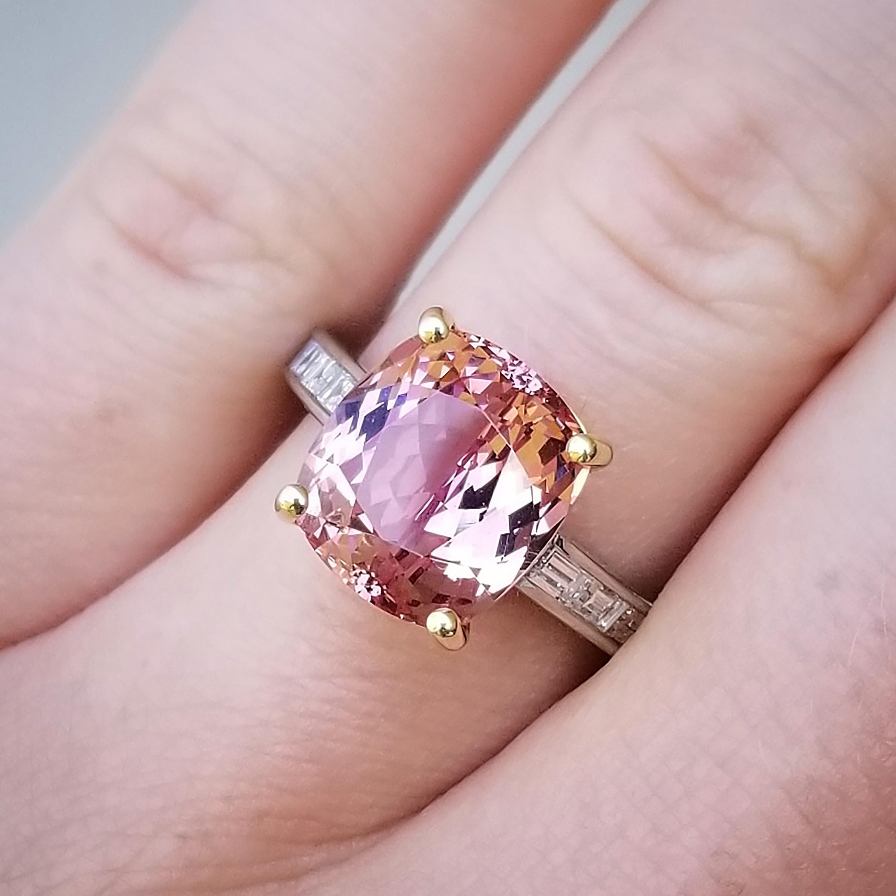 This gorgeous Mahenge Garnet features a peachy-pink color with violet tones and red flash; it's a unique color I've never seen in another gem. Because it’s a well-cut Mahenge garnet, the flash and sparkle of this stone are outrageous. This is a look