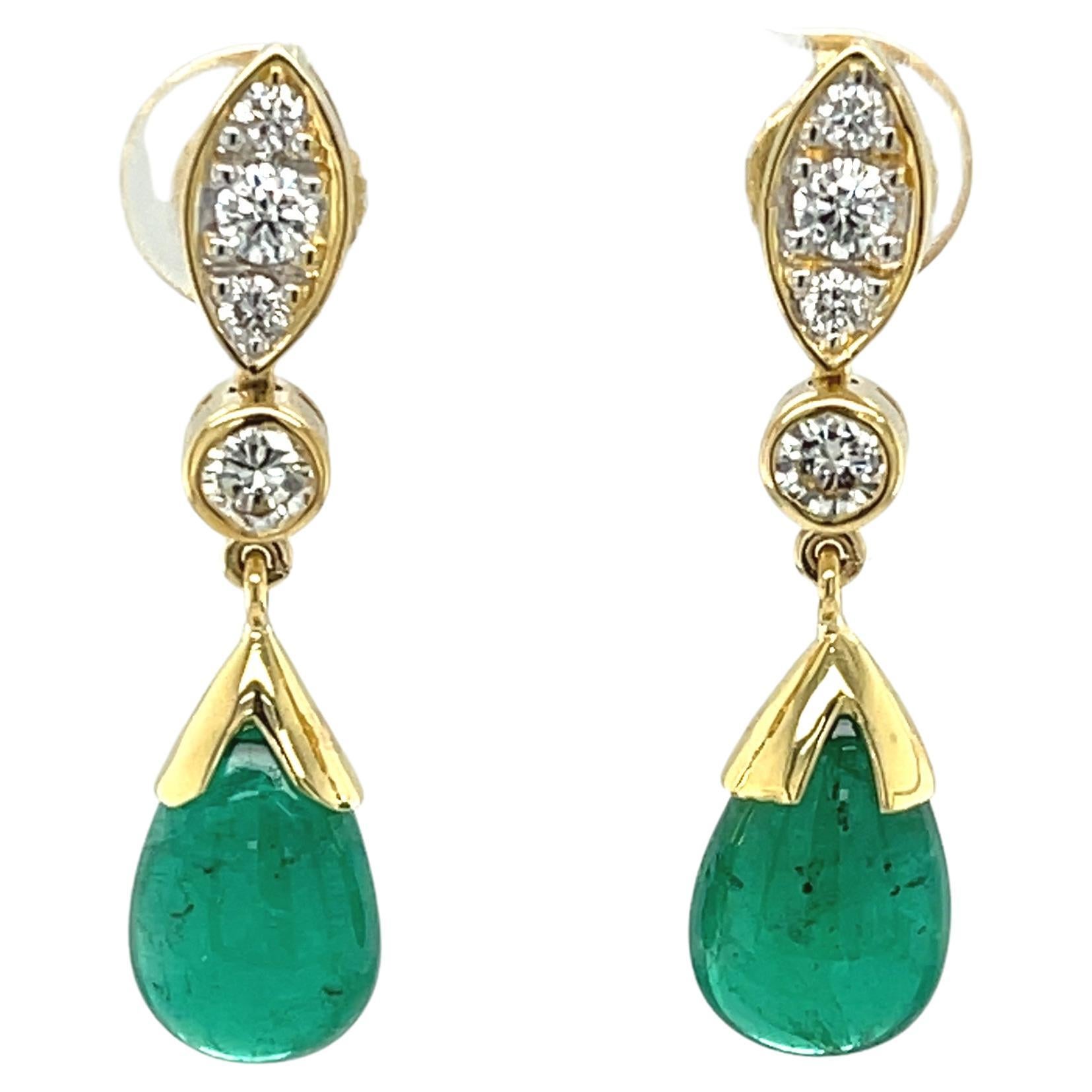 These gorgeous earrings pair luxurious emerald drops with sparkling diamonds and 18k yellow gold for a look of ultimate glamour and sophistication! The emeralds are beautifully matched and boast perfect emerald green color. Set in 18k yellow gold