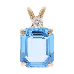 6.84 Carat Emerald Cut Swiss Blue Topaz and Diamond Pendant in 14 Karat Gold