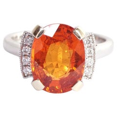 Anello con granato Spessartit da 6,84 carati e diamante in oro bianco 18 carati