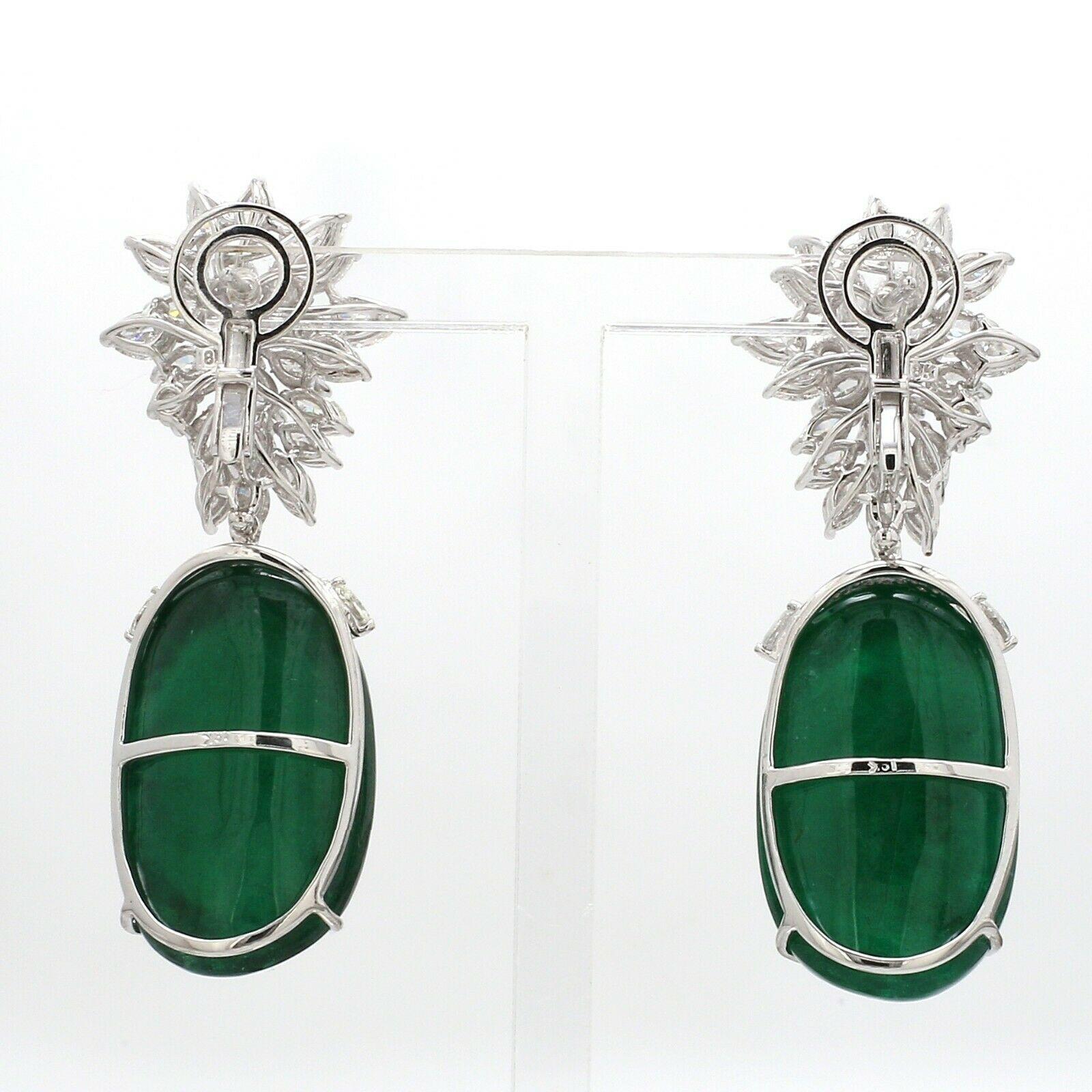 These exquisite earrings are handcrafted in 14-karat white gold. It is set in 68.40 carats emerald and 7.86 carats of sparkling diamonds.

FOLLOW MEGHNA JEWELS storefront to view the latest collection & exclusive pieces. Meghna Jewels is proudly