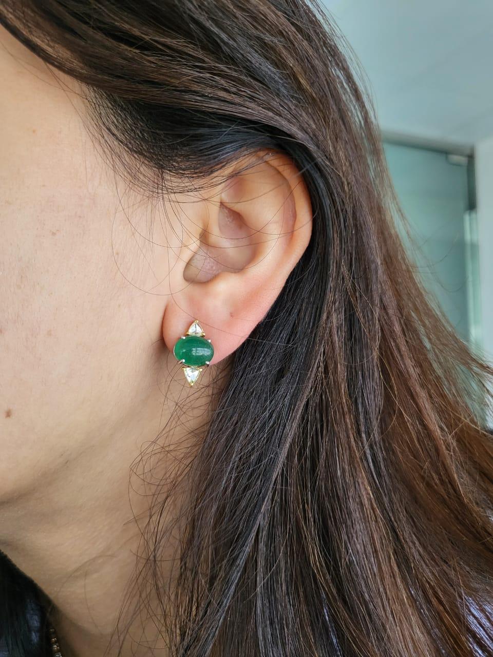 A very beautiful and one of a kind, Emerald Necklace and Earrings set in 18K Gold & Diamonds. The weight of the Emerald cabochons is 68.47 carats. The Emeralds are completely natural, without any treatment and is of Zambian origin. The weight of the