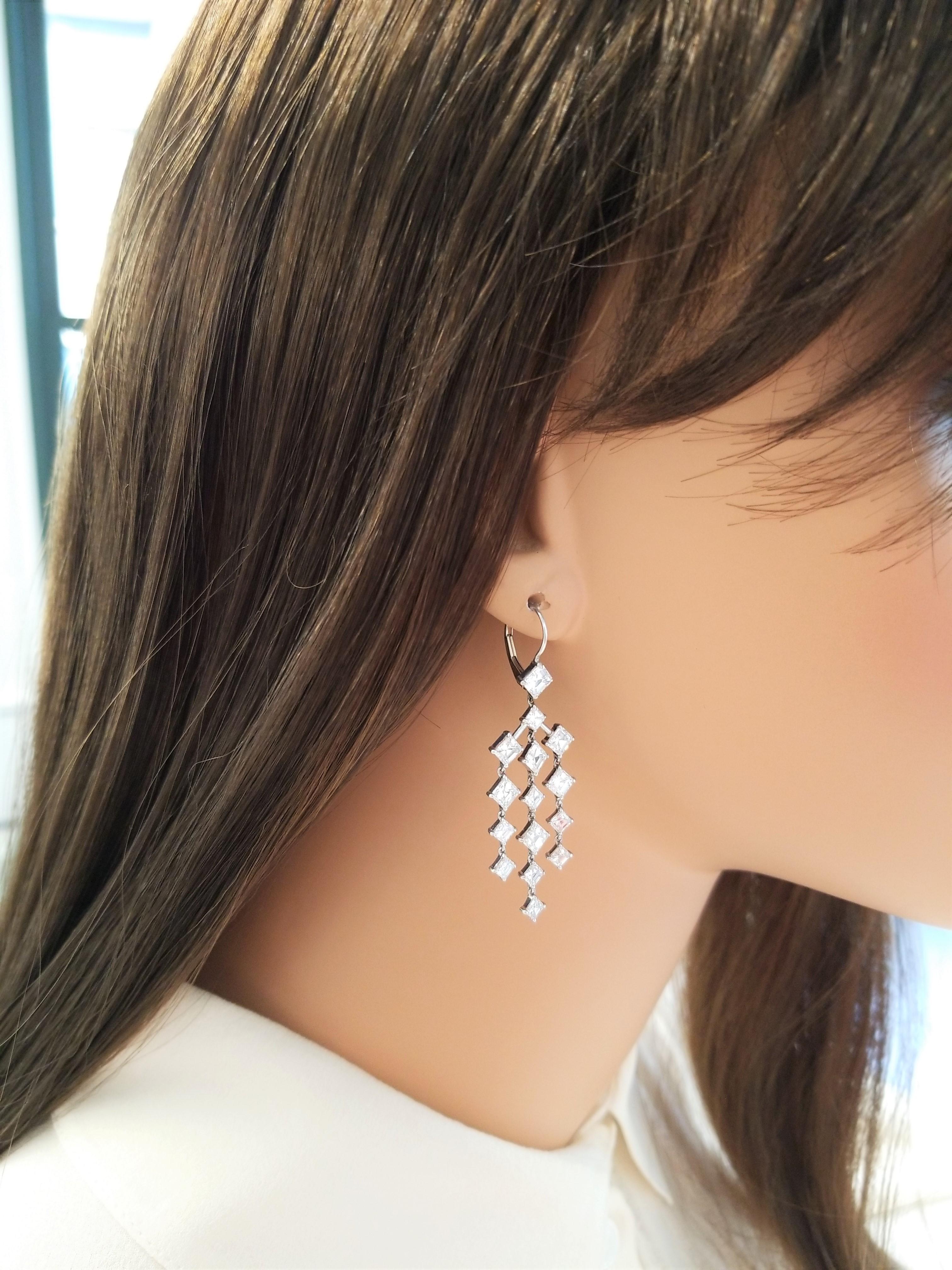 Nothing says elegance like a shimmering pair of chandelier earrings with exceptional movement! Dripping with diamonds in the most stunning way possible, these exquisite handcrafted designer earrings are the perfect earrings to be worn with your hair