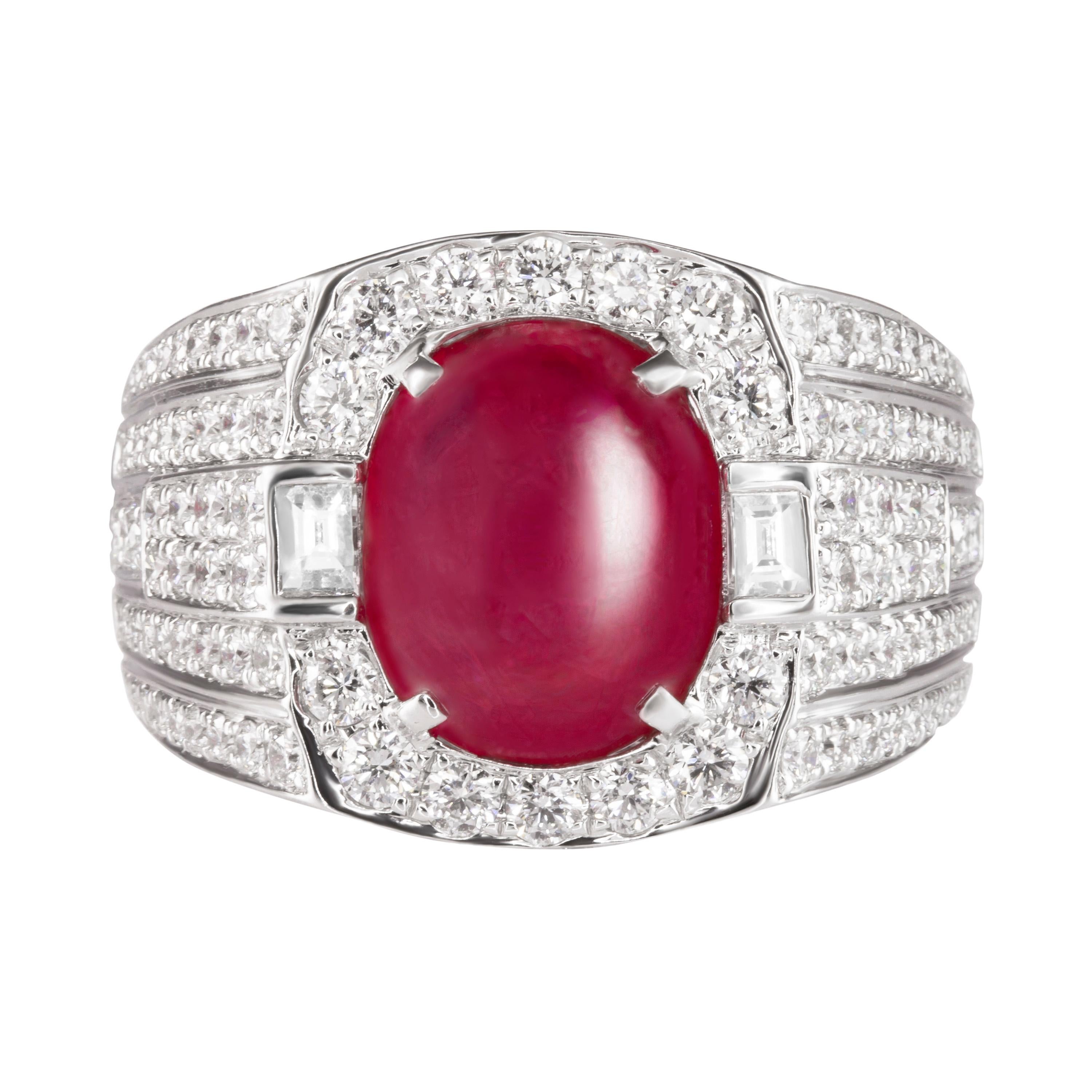 Cast from 18K white gold and adorned with 2.64 carats of sparkling baguette and round diamonds, this ring has a 6.85 carat cabochon ruby at the center.  Currently a ring size US 9.  For other sizes, please contact seller.  

Composition: 
18K White