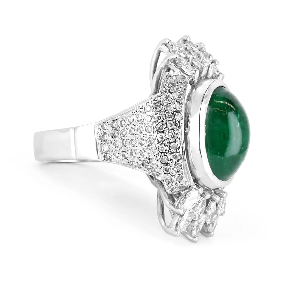 As regal as can be, this estate emerald and diamond cocktail ring is inspired by the Victorian period. It is quite a luxurious work of art and a true showstopper. A natural Colombian emerald cabochon is the center of attention and displays beautiful
